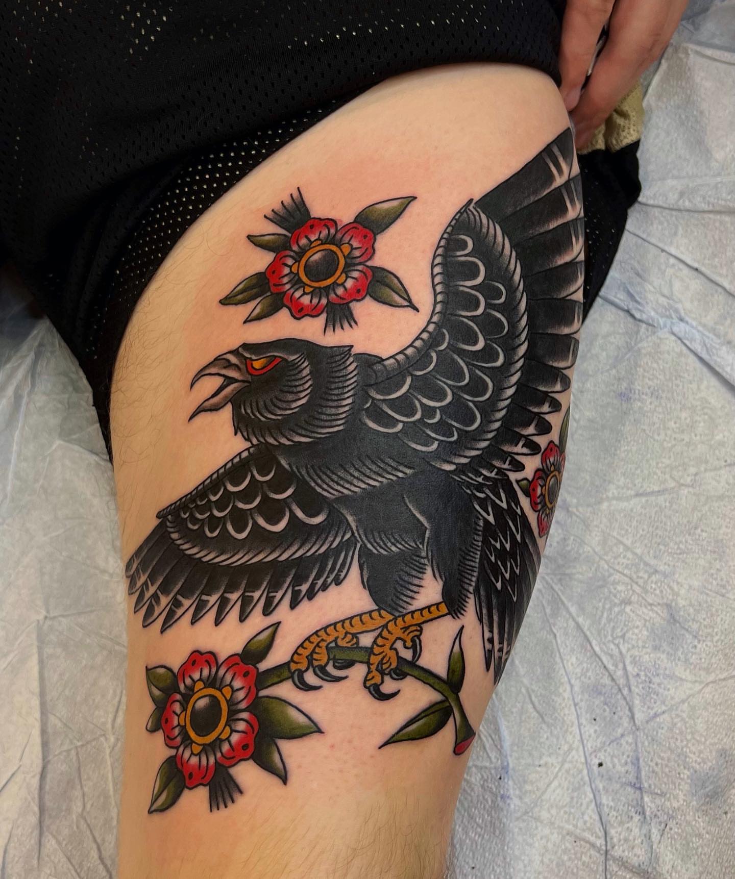 Eagle and flowers American traditional tattoo on the thigh by David Mendieta