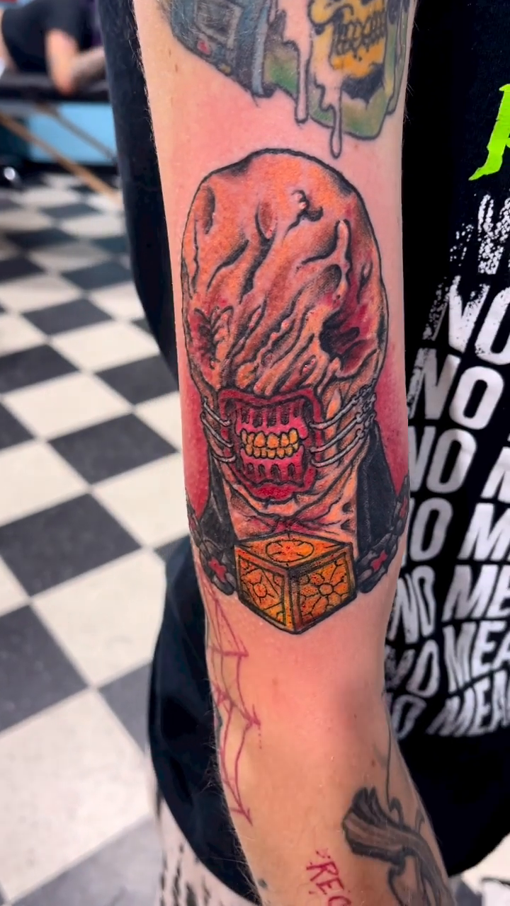 Demonic skull with a box dark realism tattoo by Edward Choat