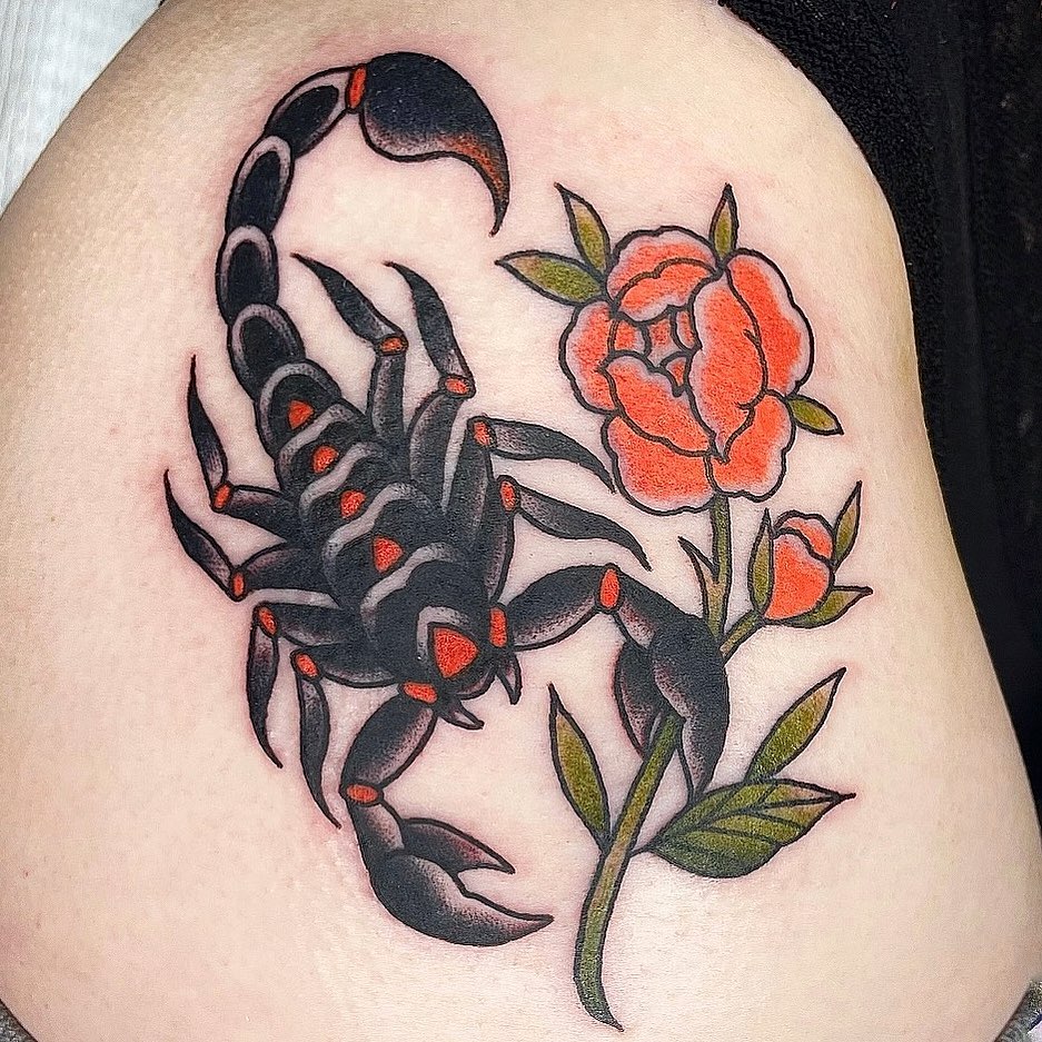 Scorpion and rose American traditional tattoo on the thigh by Danielle Dubois