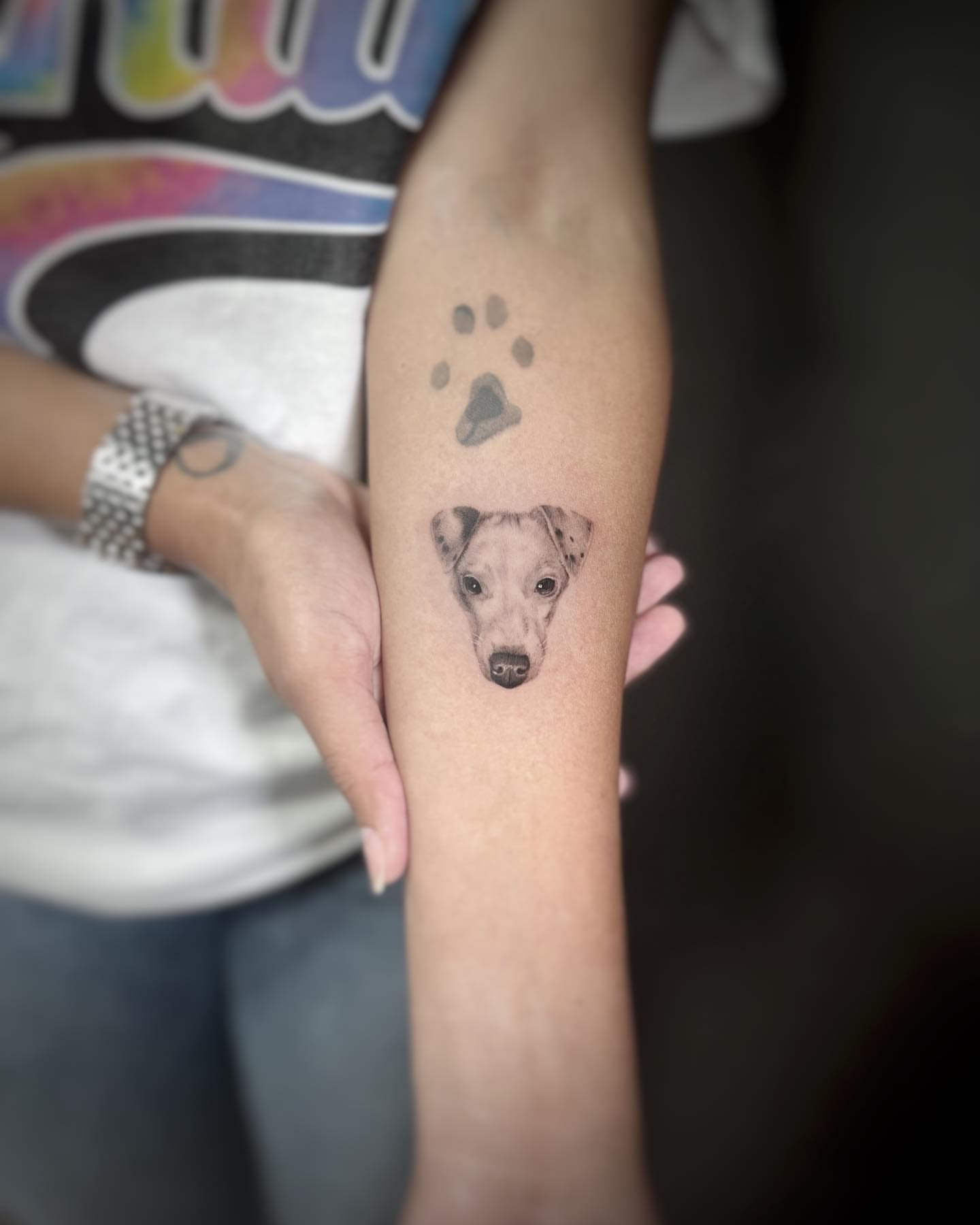 Dog dotwork tattoo on the forearm by Nana