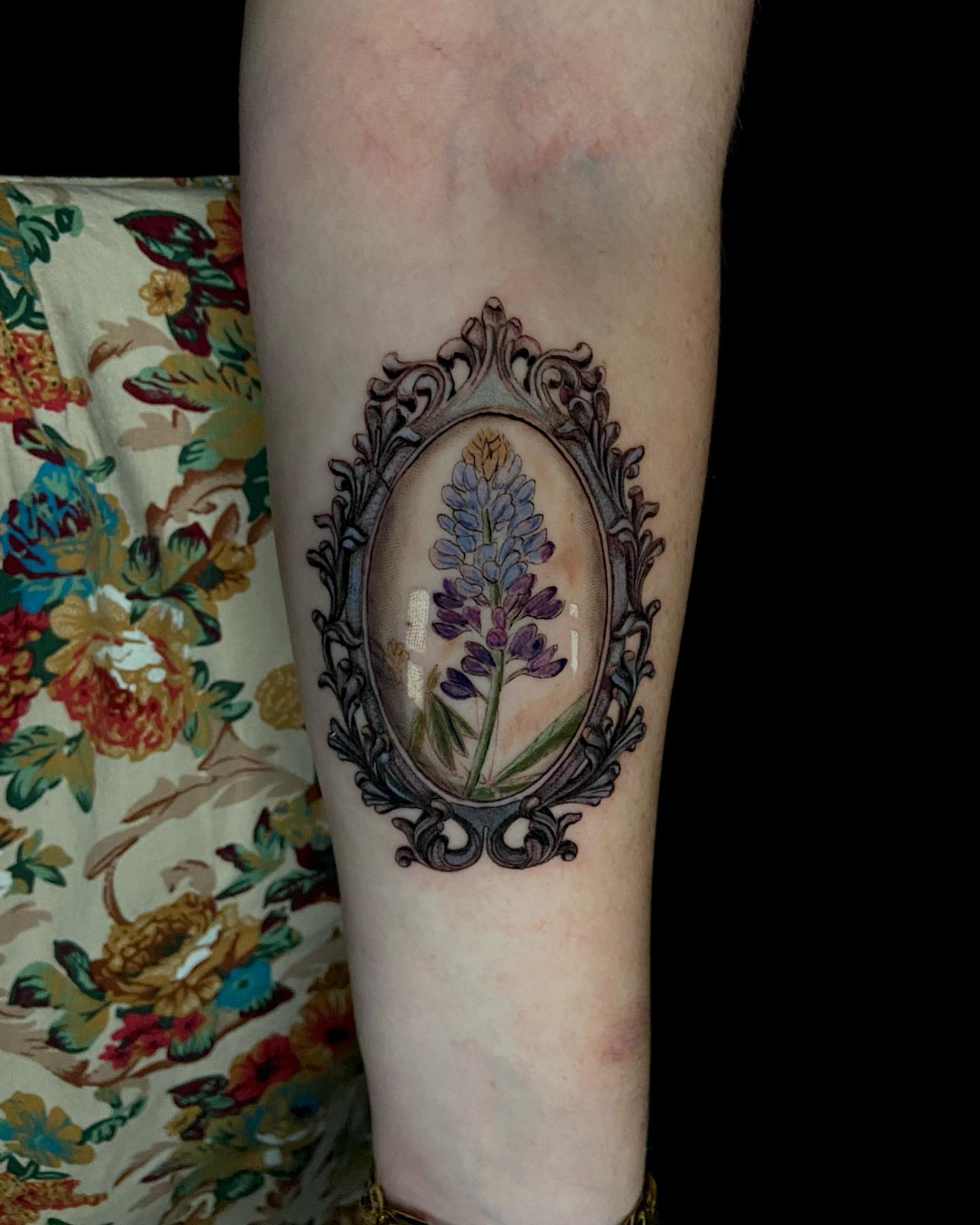 Flower in ornate frame realism tattoo on the forearm by Jules, Arlington, Texas