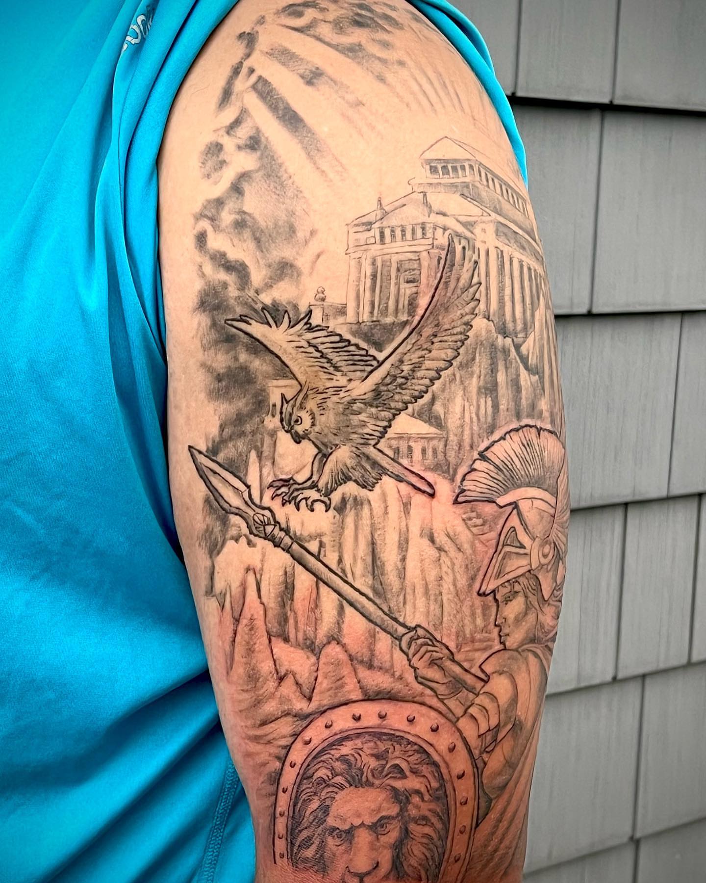 Ancient warrior and owl realism tattoo on the forearm by Iconic Ink, Millbury, Massachusetts