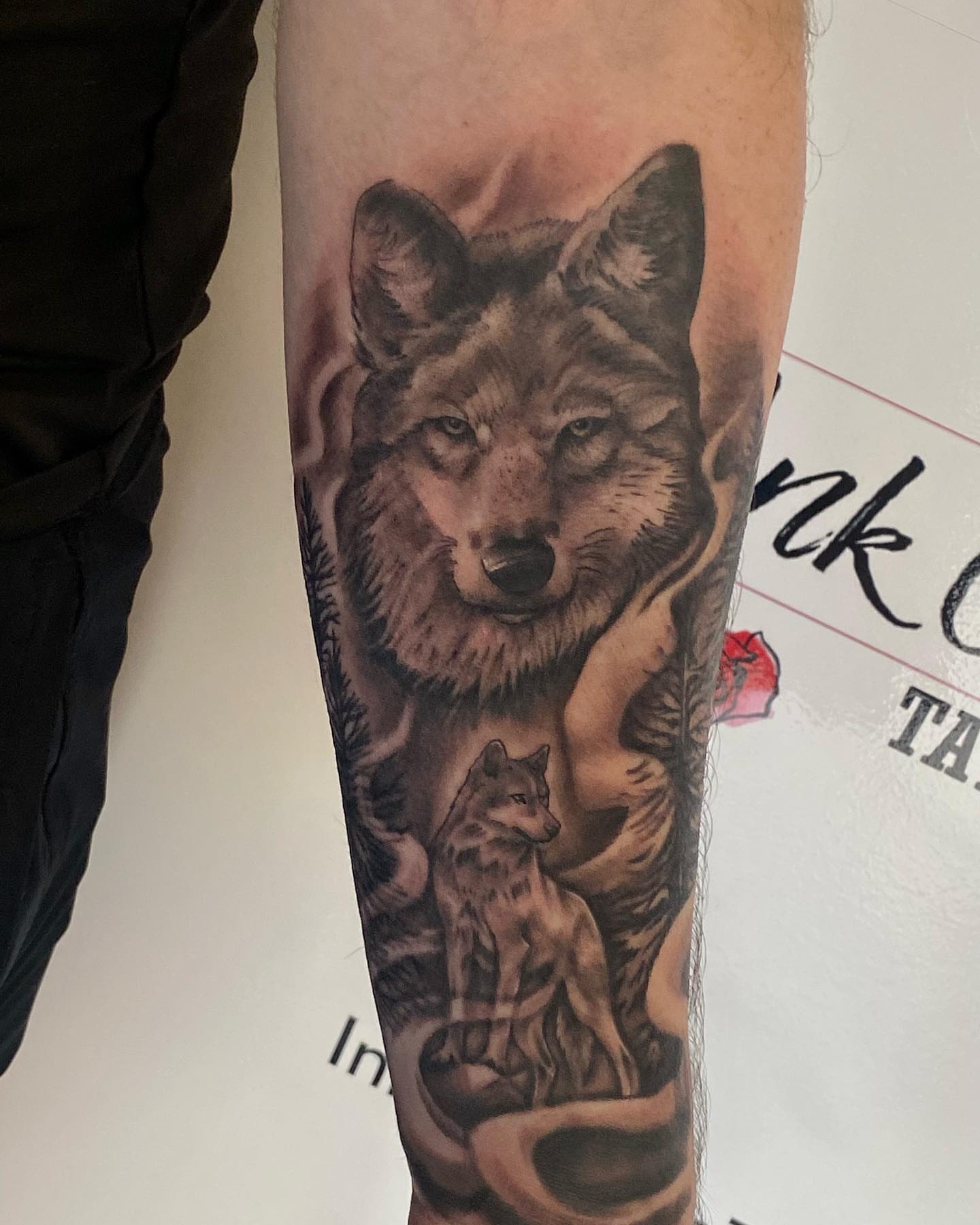 Wolf and cub realism tattoo on the forearm by Justin James