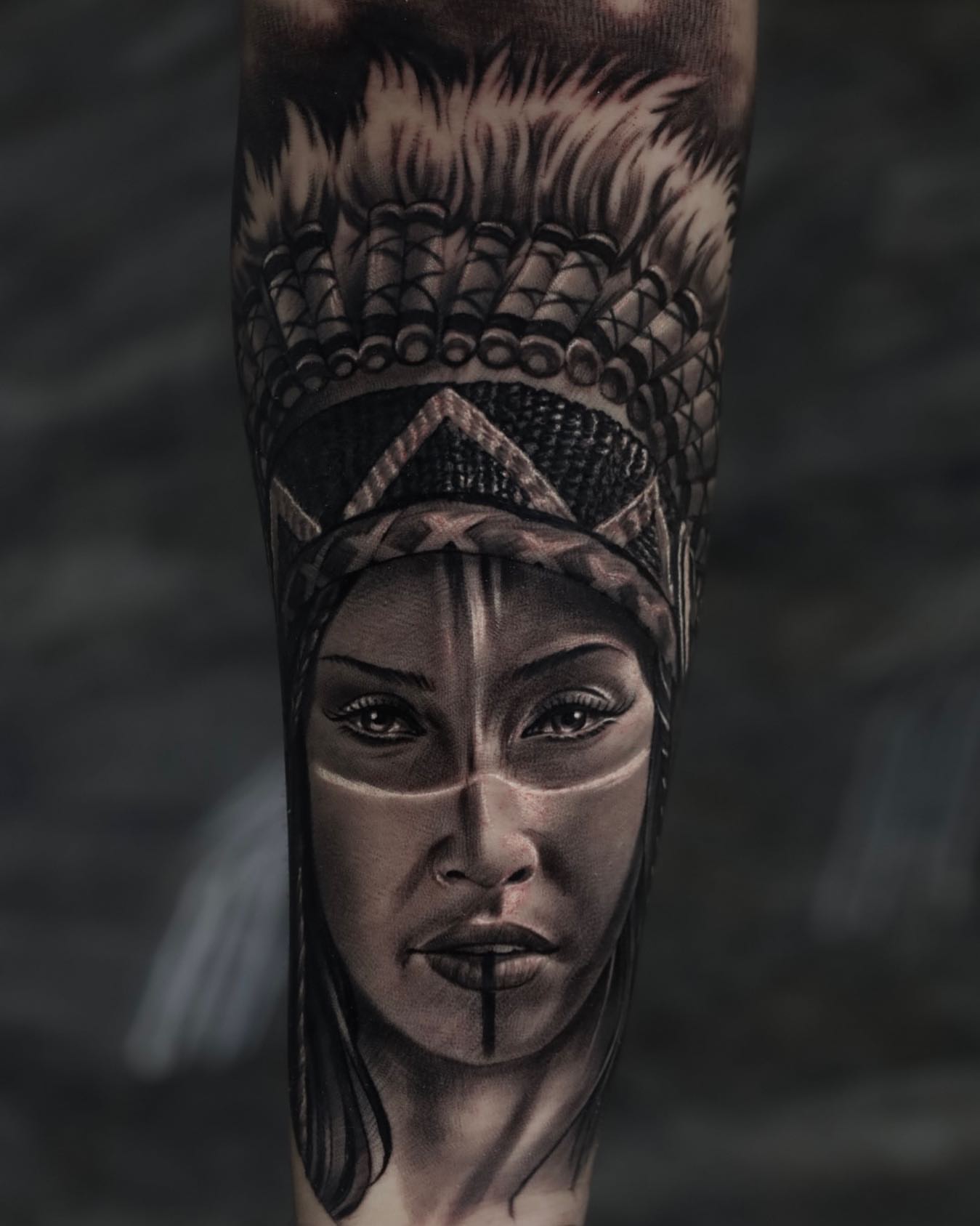 Woman with headdress realism tattoo on the forearm by Tattoos By Chino