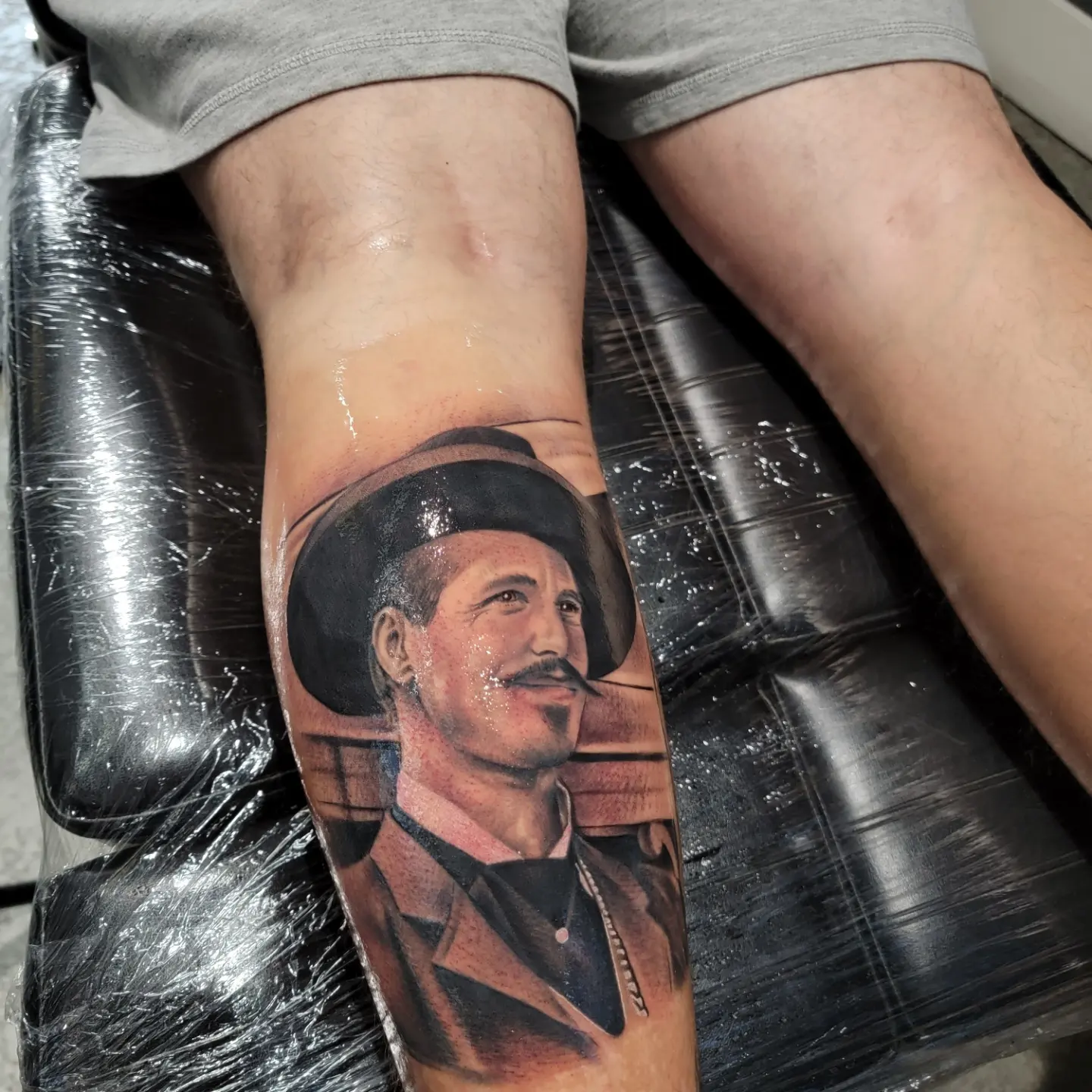 Portrait realism tattoo on the forearm by Mark Melanson