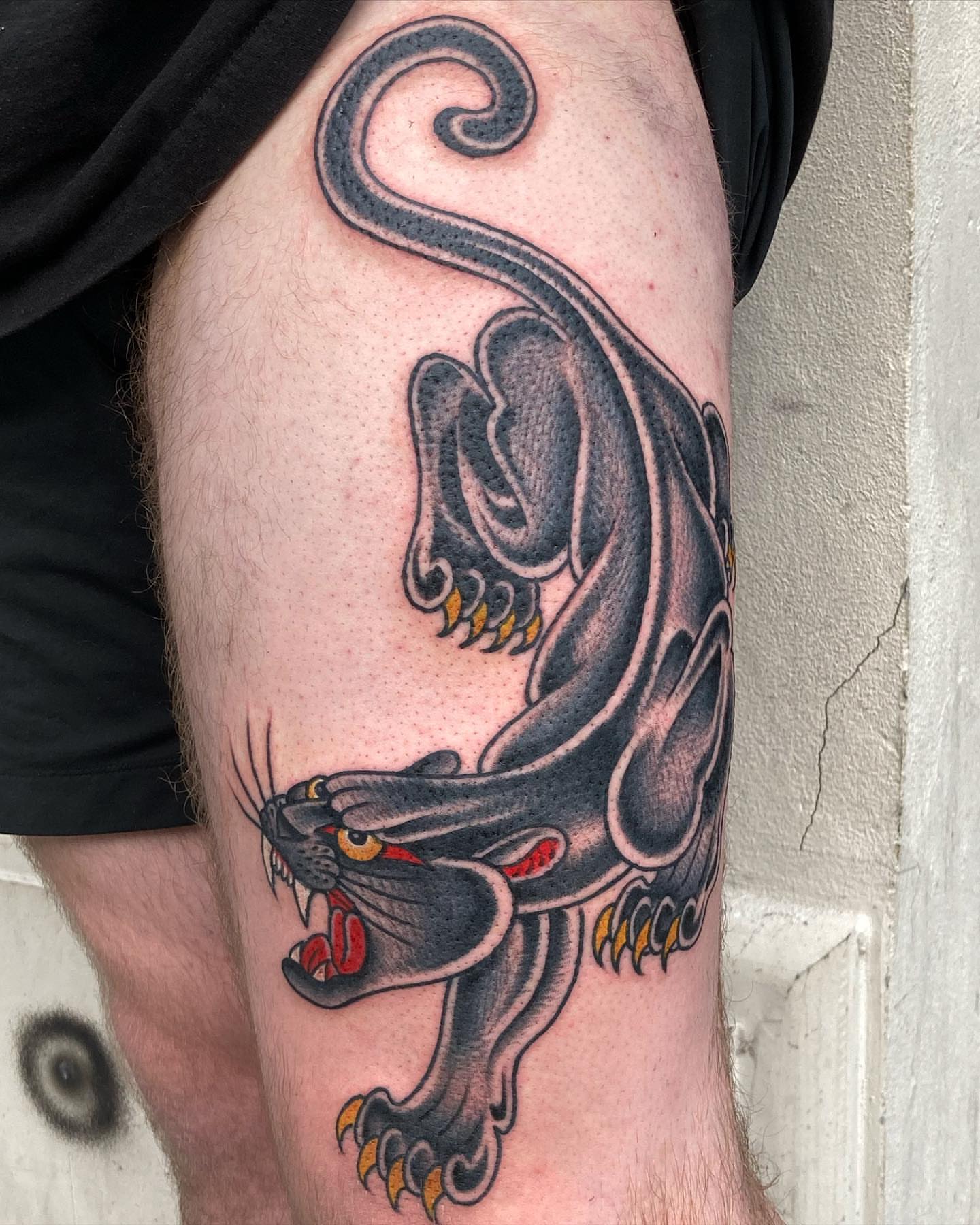 Panther American traditional tattoo on the thigh by Rob Banks