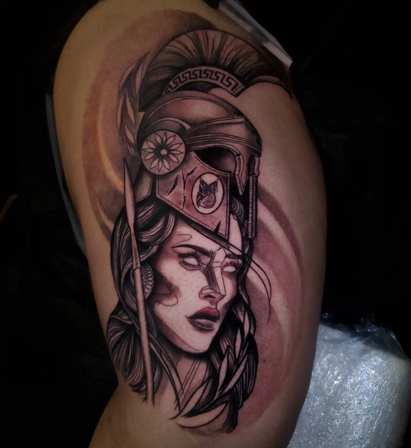Woman warrior helmet realism tattoo on the thigh by BoogaInk
