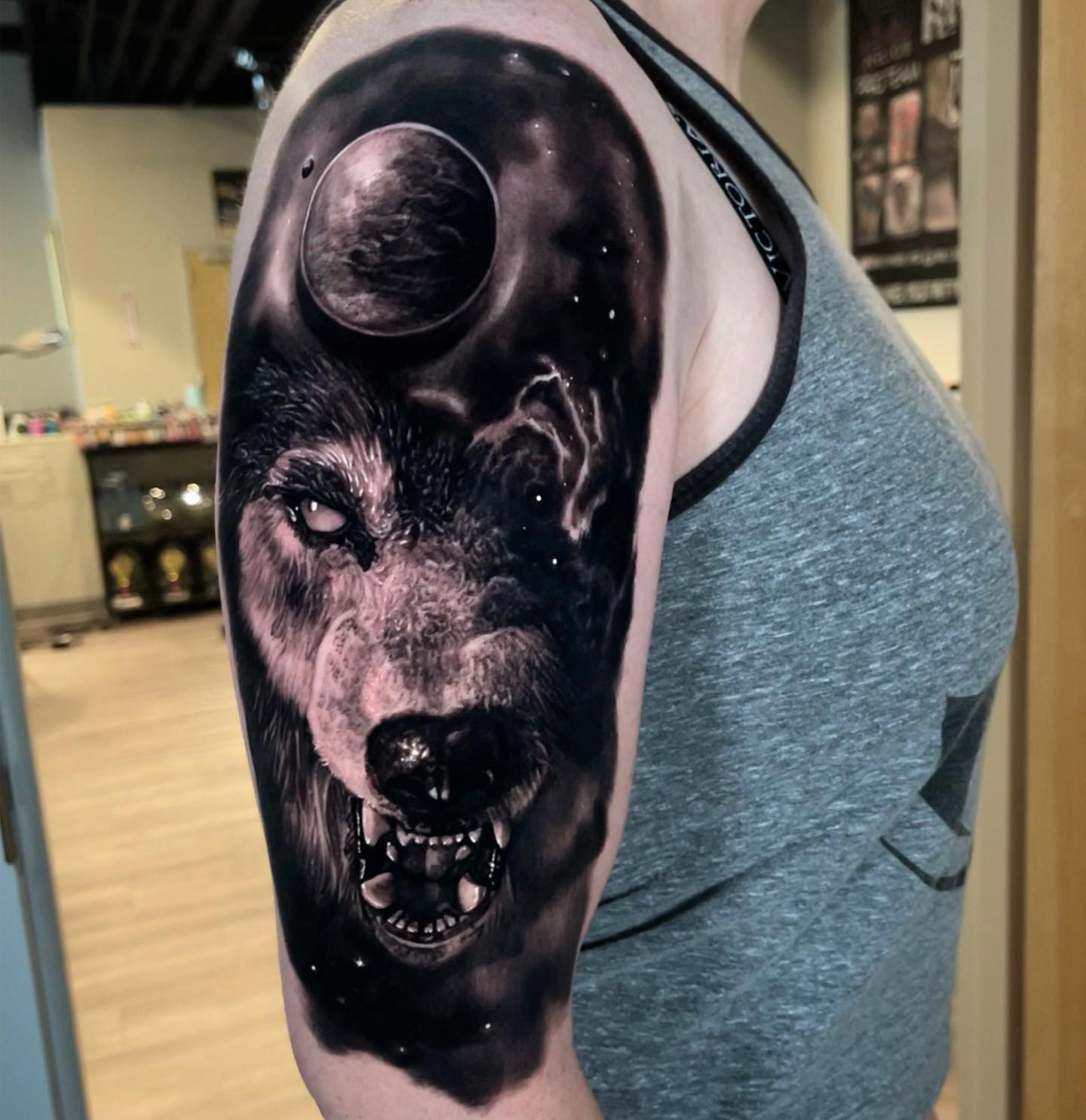 Wolf realism tattoo on the upper arm by Kasey Gonzalez, Bel Air, Maryland