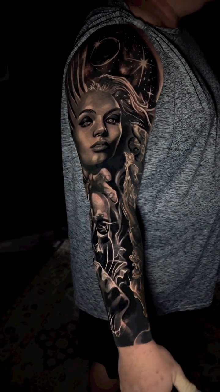 Woman and skull with celestial elements realism tattoo by Travis Chick