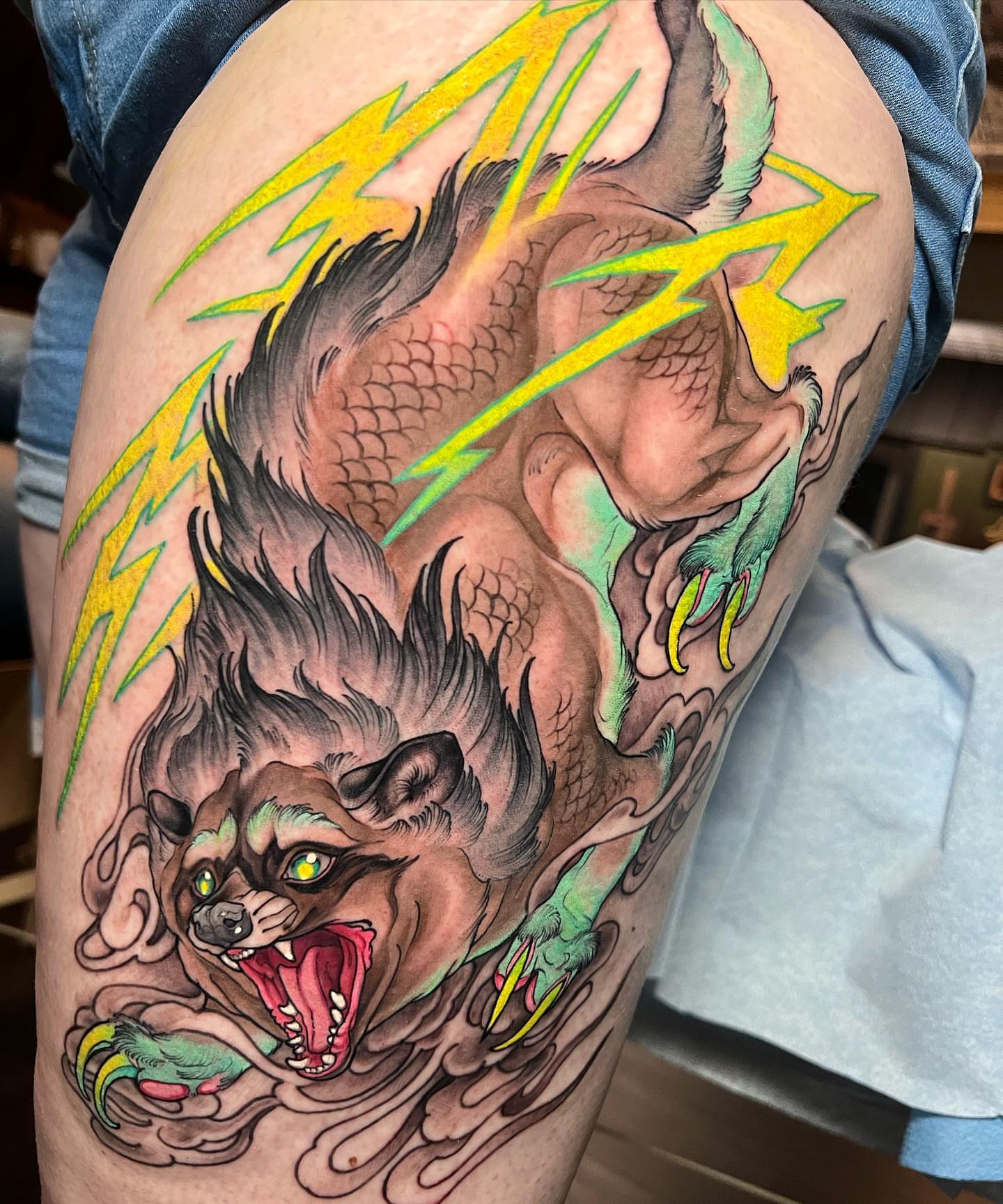 Wolf American traditional tattoo on the thigh by Alisha Harding