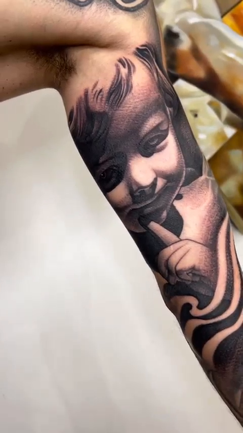 Baby face realism tattoo by Joseph Alvarado