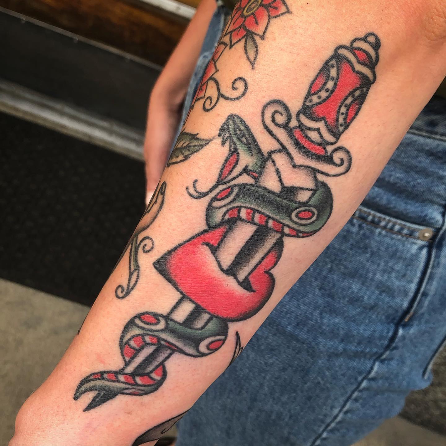 Snake and dagger American traditional tattoo on the forearm by Paul Trimble