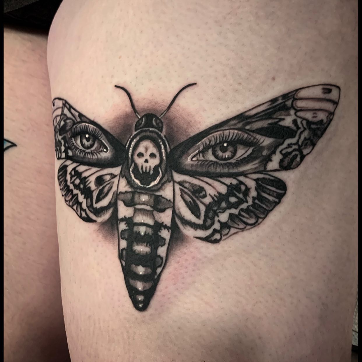 Death moth realism tattoo on the thigh by Izak Blanke, Murfreesboro, Tennessee