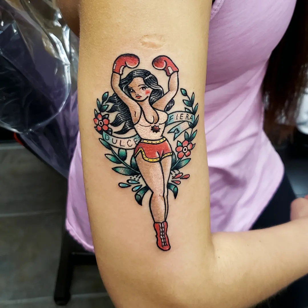 Boxing pin-up girl American traditional tattoo on the forearm by Jake Lee