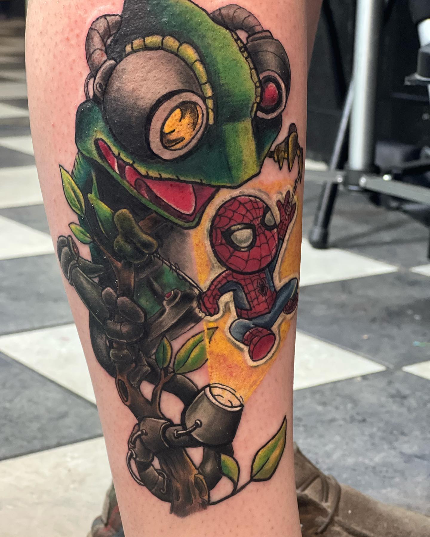 Spider-man and plant robot American traditional tattoo on the forearm by Glen Wallis
