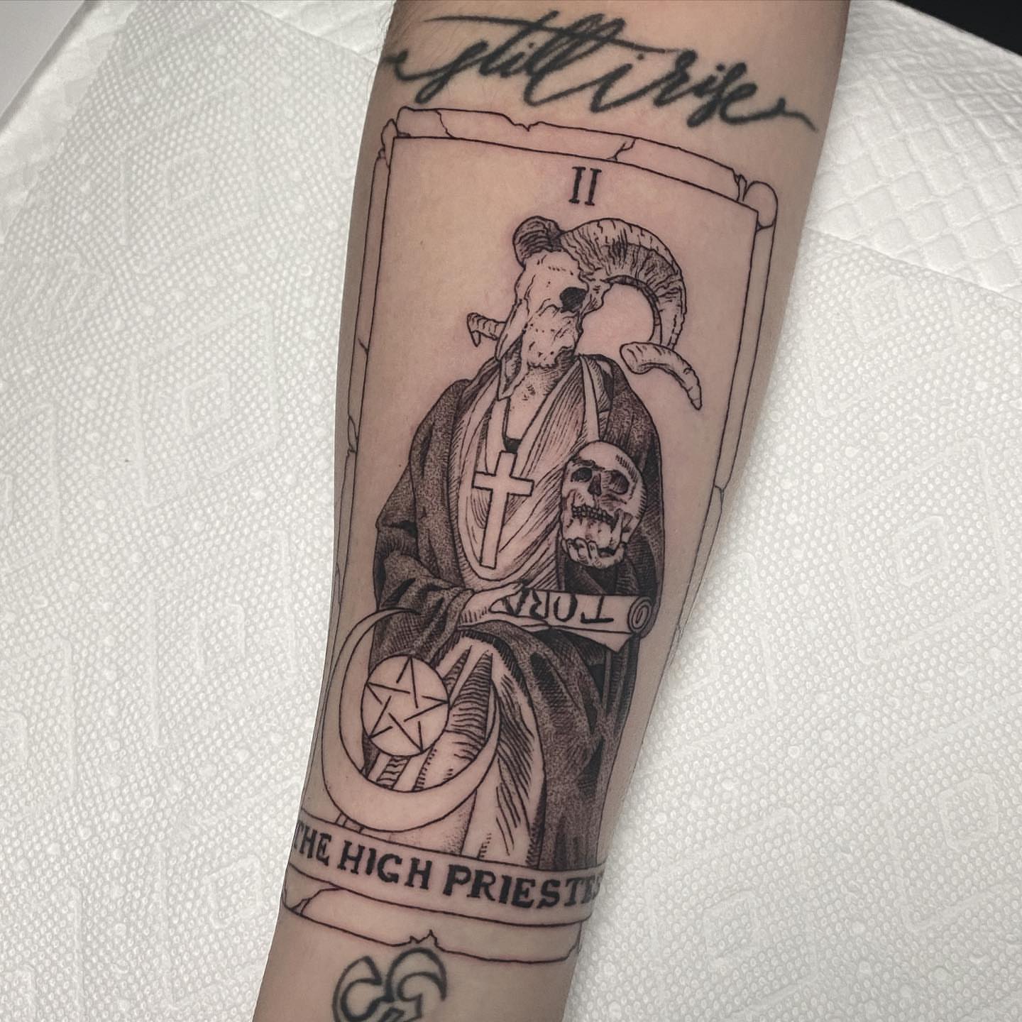 High priest tarot card black and grey tattoo on the forearm by Sydney Dixon, Sacramento, California