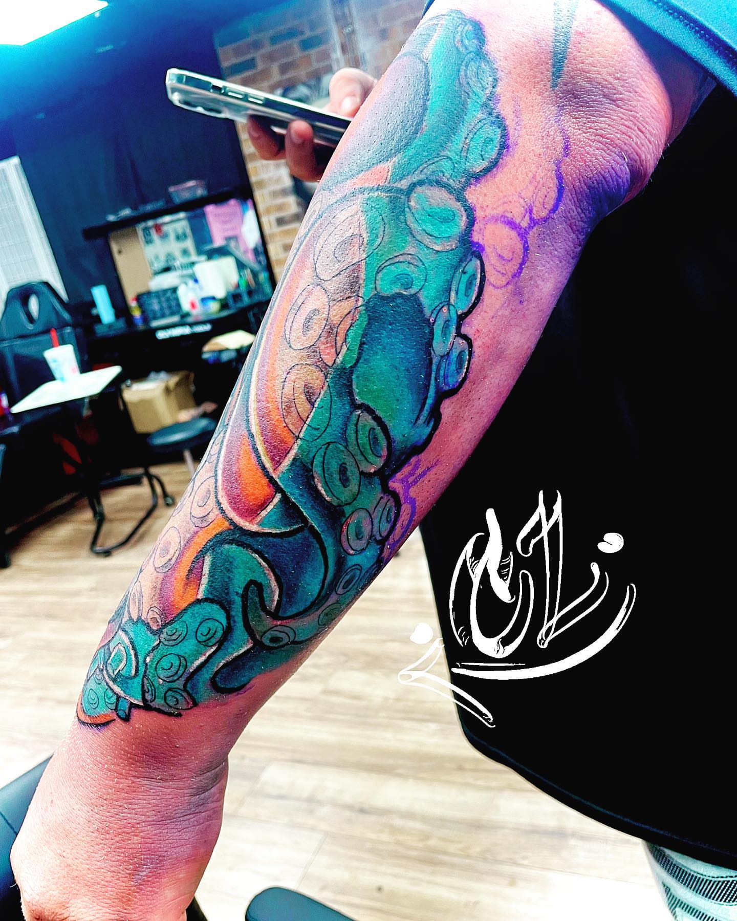 Octopus tentacle new school tattoo on the forearm by Labbé
