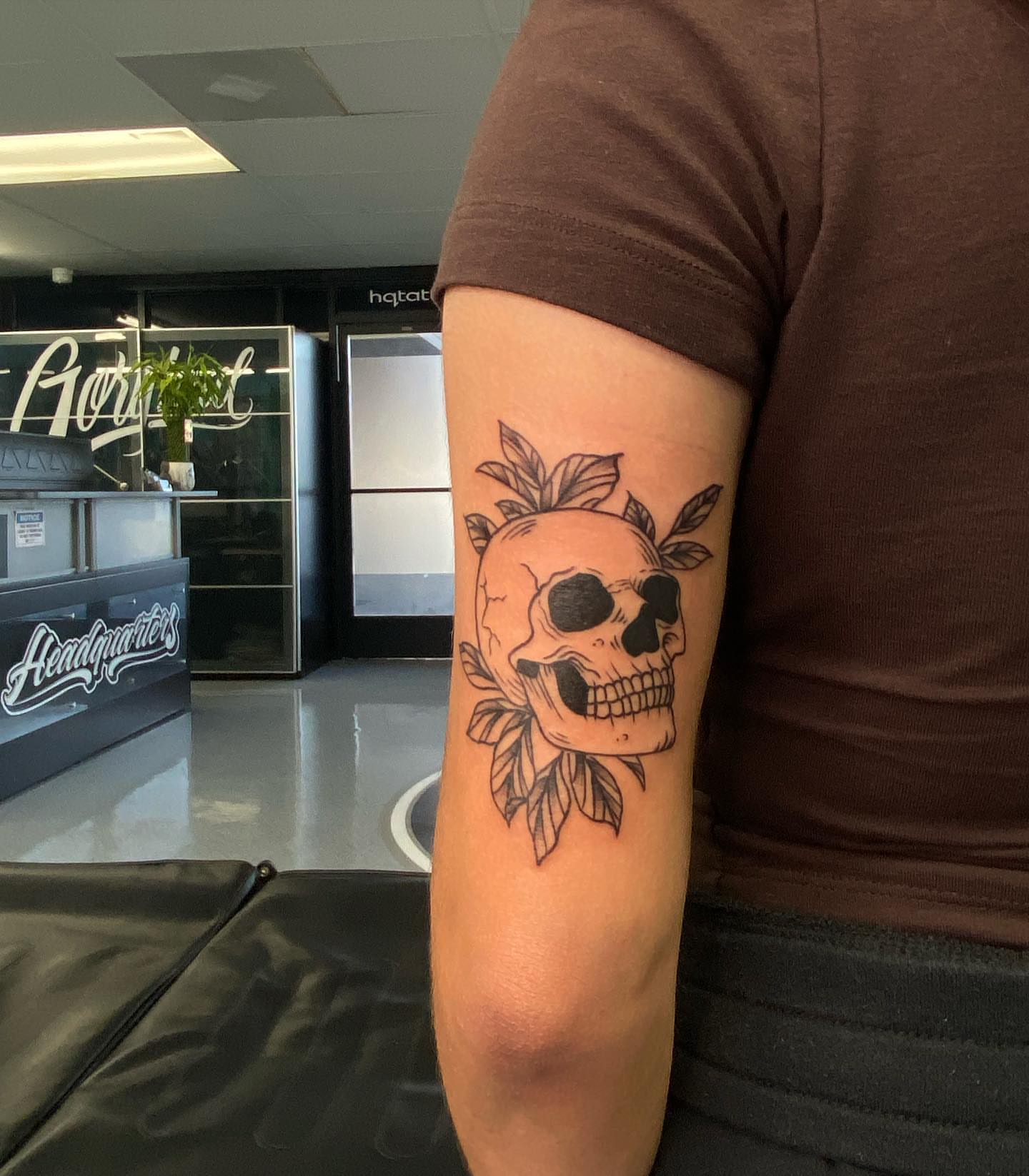 Skull with leaves black and grey tattoo on the forearm by Steph π€