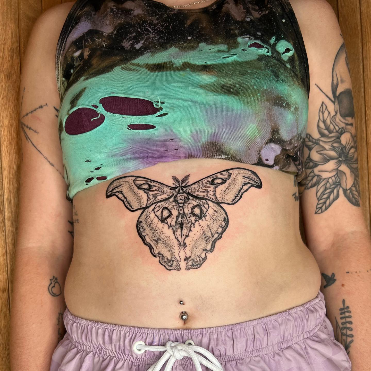 Moth dotwork tattoo on the torso by ᴀmb⃘er