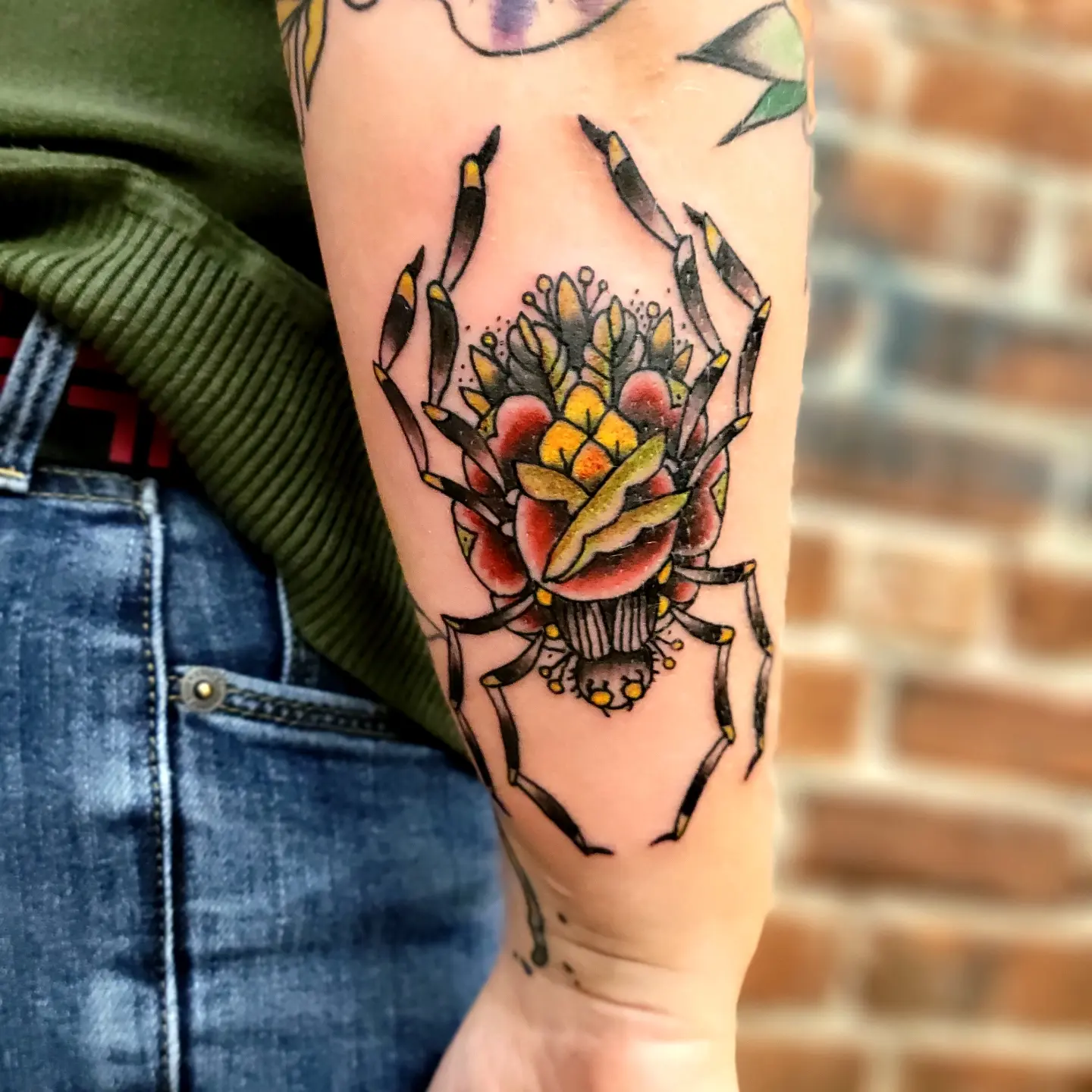 Flower crab American traditional tattoo on the forearm by Tim Andrews