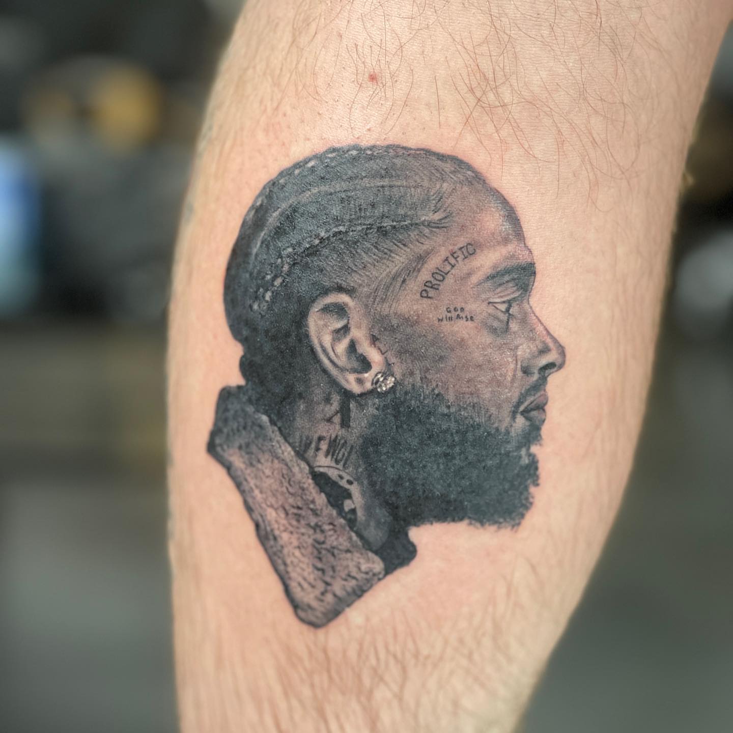 Man with dreadlocks realism tattoo on the forearm by Zachary Kaufhold