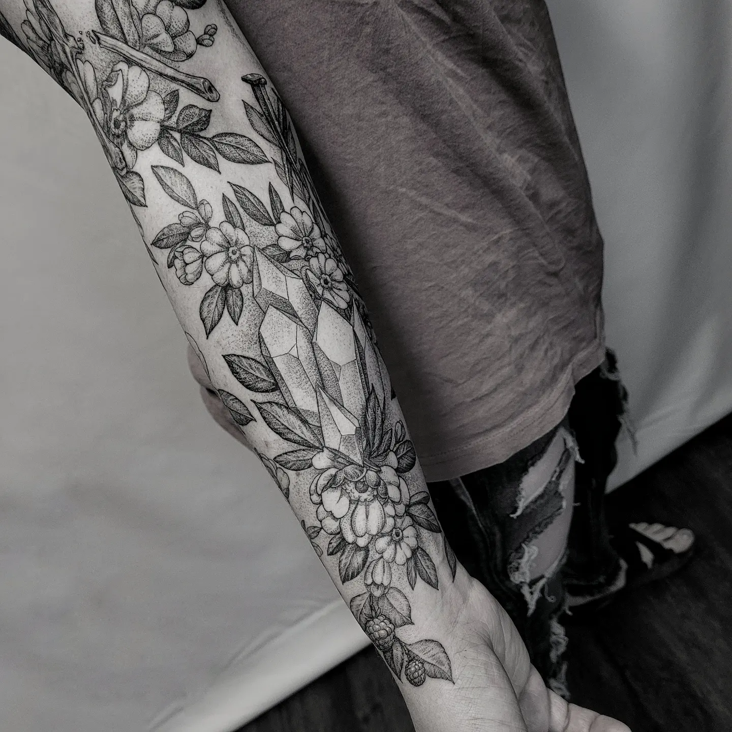 Floral arrangement dotwork tattoo on the forearm by Matthew Barnett