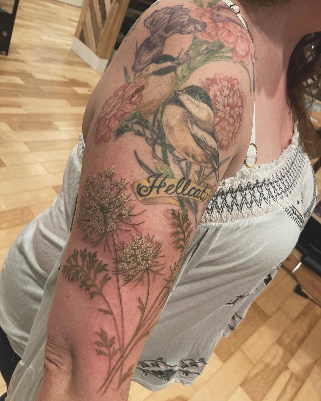 Tattoo on the upper arm by Rachel Walker