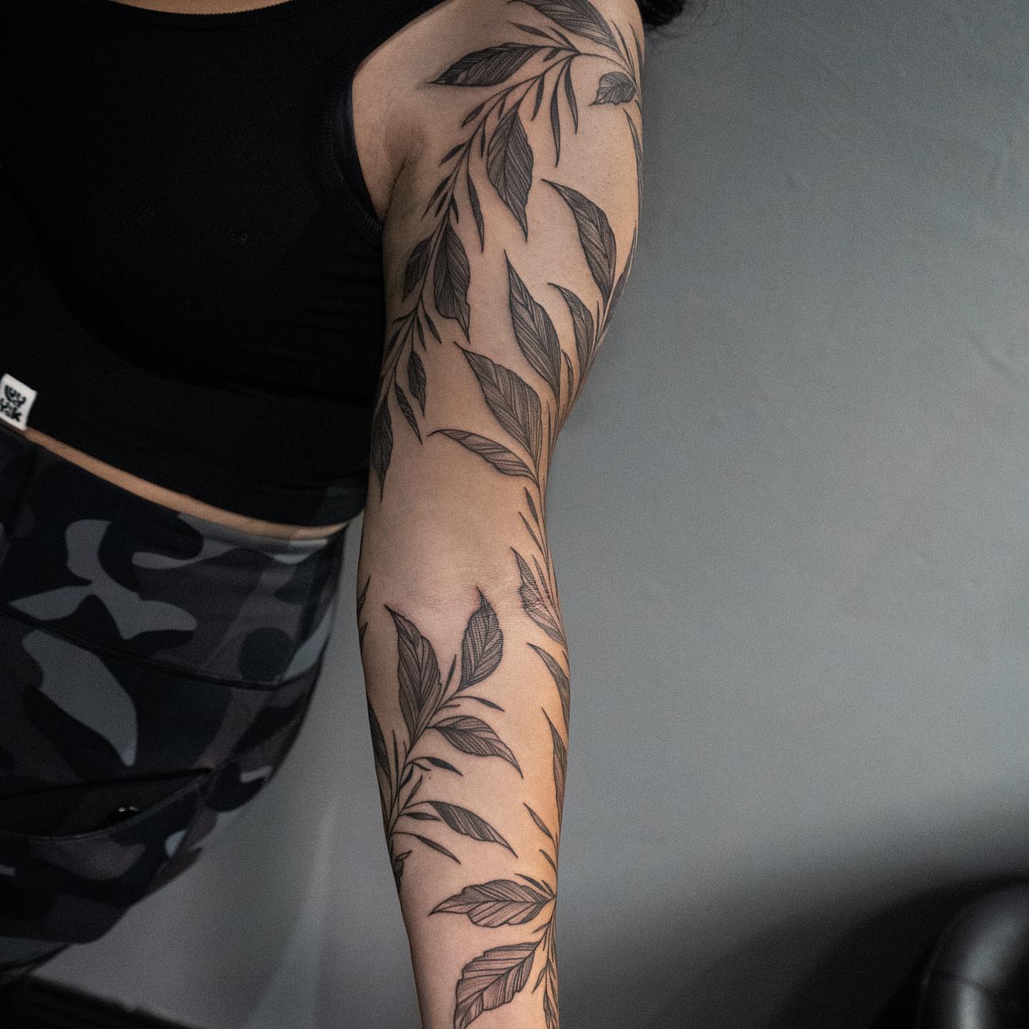 Leaf pattern black and grey tattoo on the forearm by all gas no brakes! no days off!