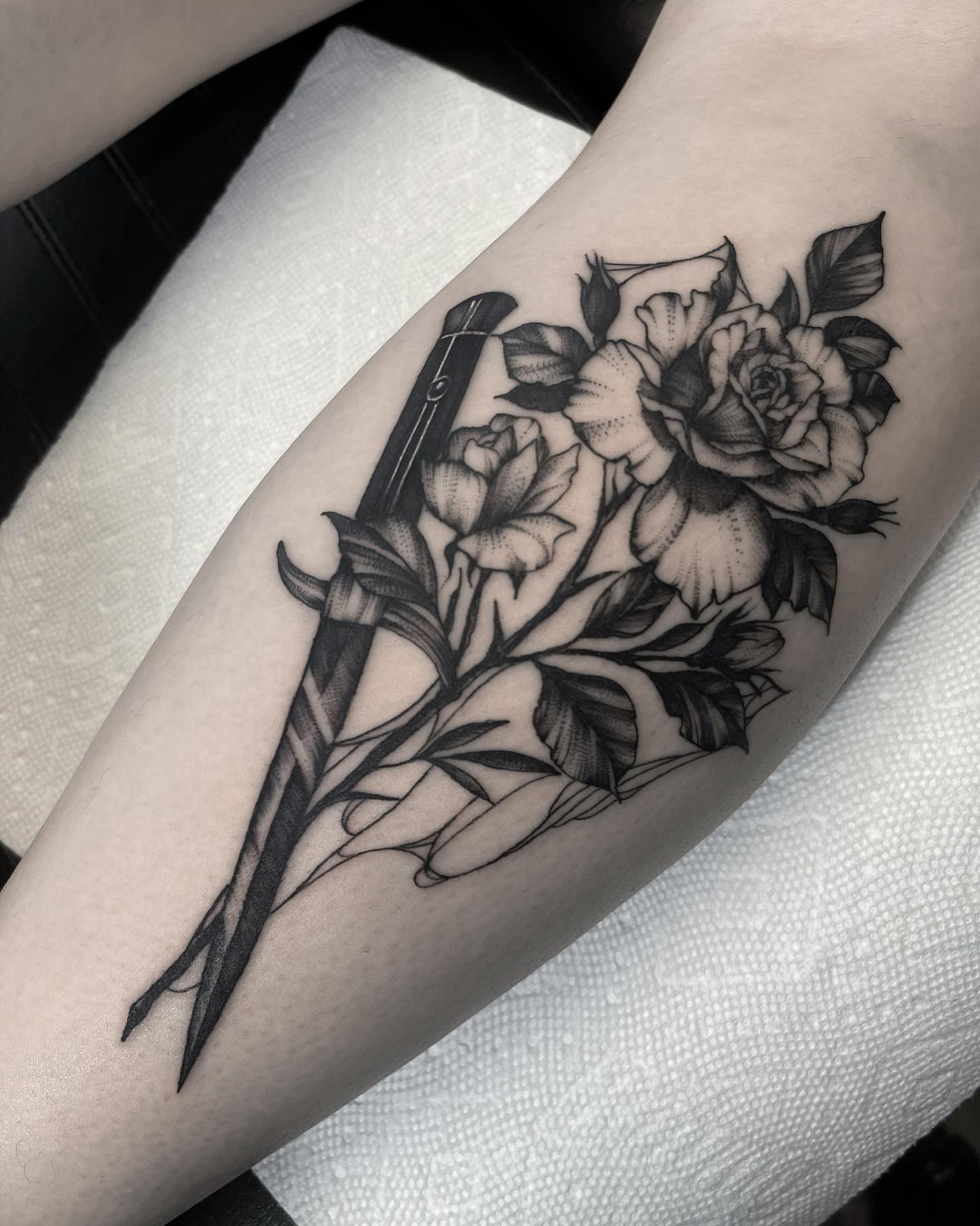 Sword and roses realism tattoo on the forearm by 𝐀𝐘𝐀𝐍𝐀𝐇