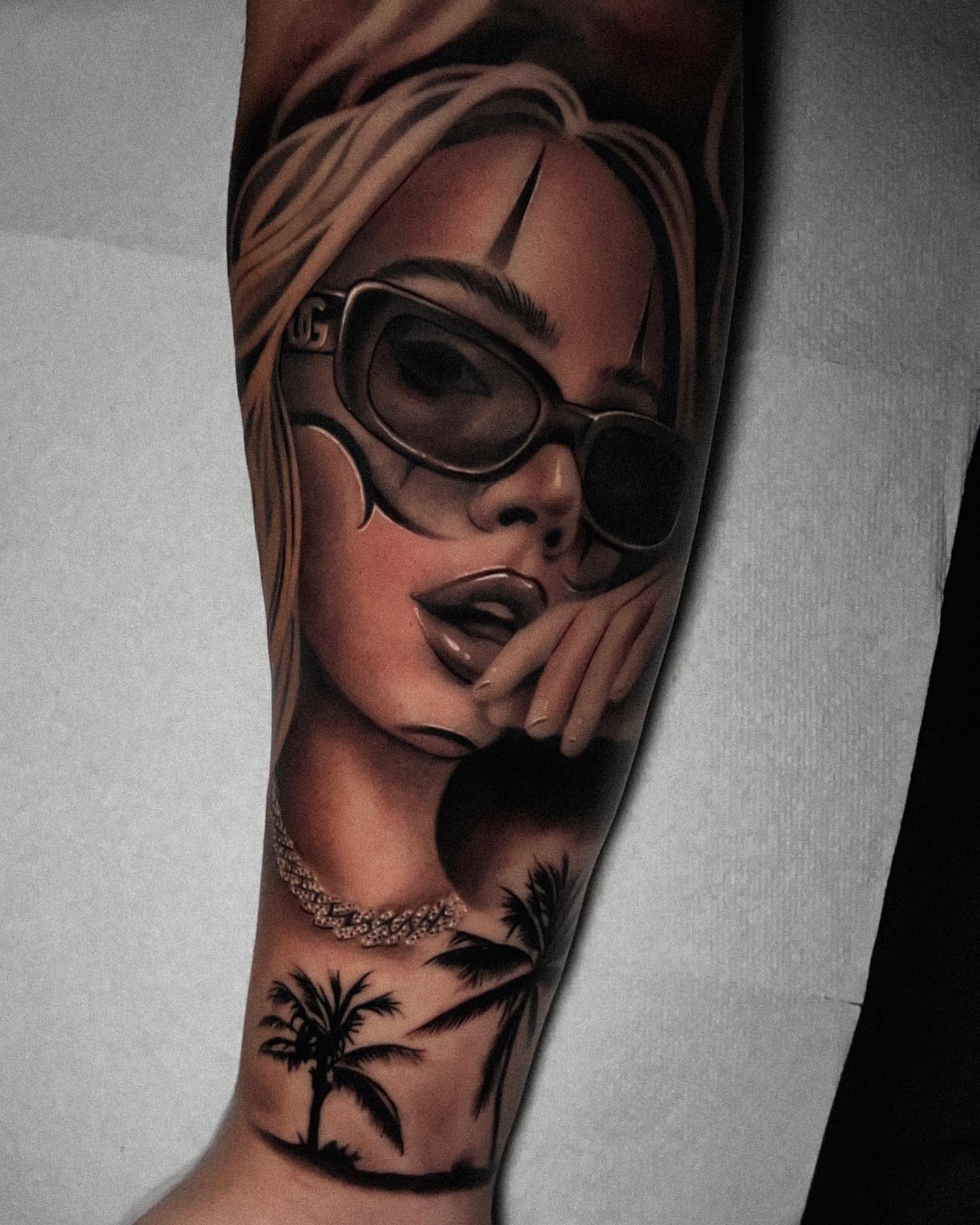 Woman wearing sunglasses realism tattoo on the forearm by Ivan Guadalupe guzman
