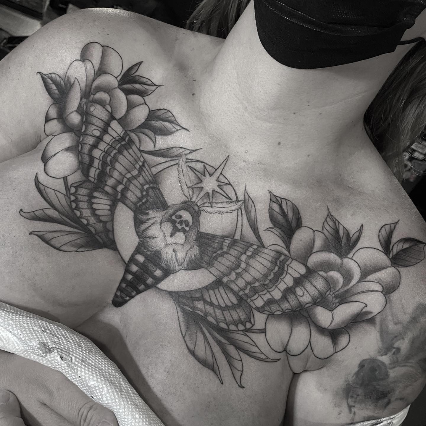 Owl and flowers American traditional tattoo on the chest by Sam Fortney, Columbus, Ohio