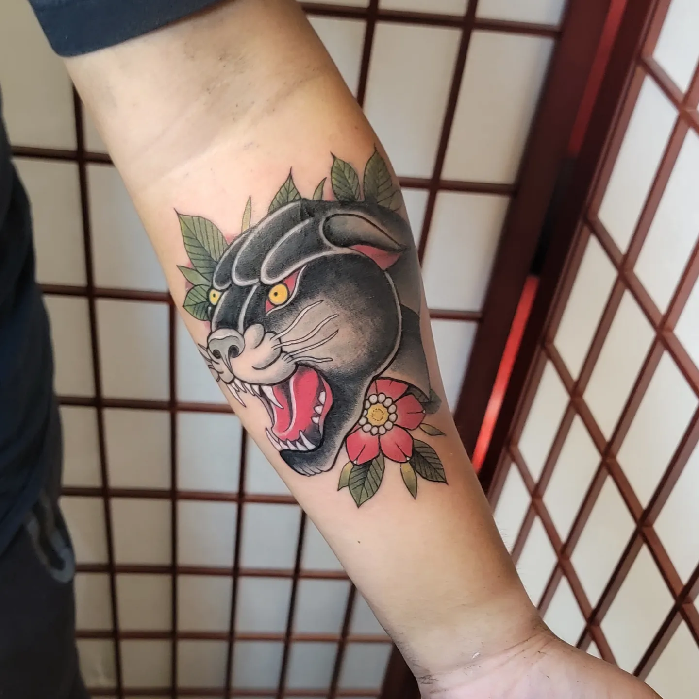 Panther with flowers American traditional tattoo on the forearm by ๐๏ธ, Ashland, Virginia