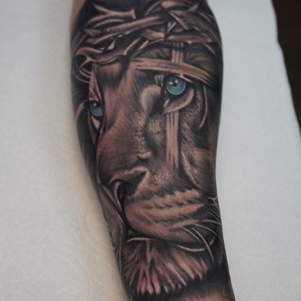 Lion realism tattoo on the forearm by Summer Rain