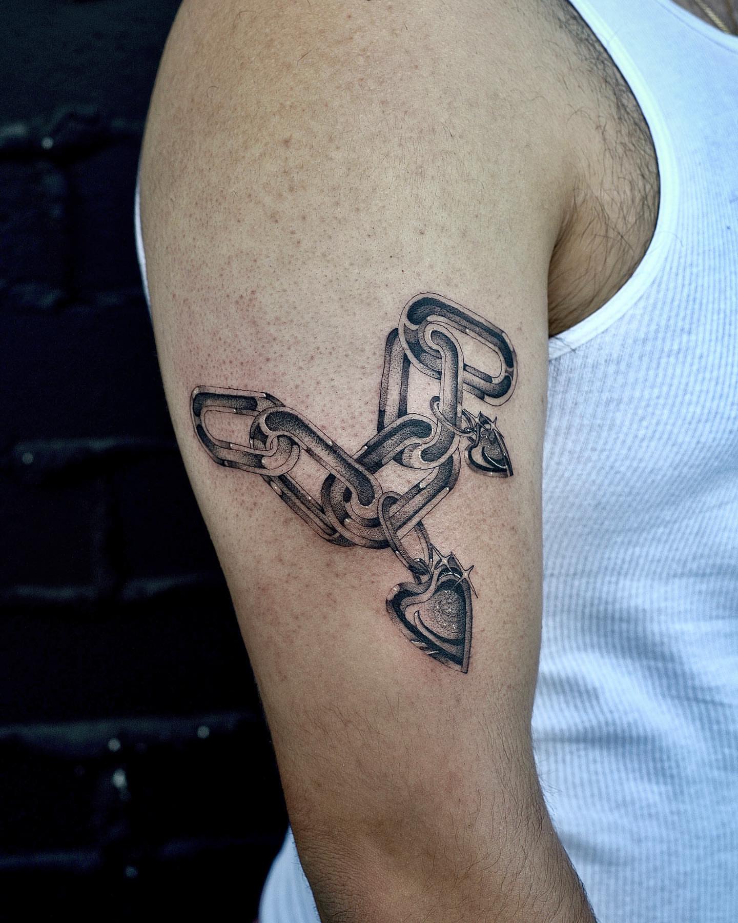 Chain and heart black and grey tattoo on the forearm by Fine line tattoo San Diego, San Diego, California