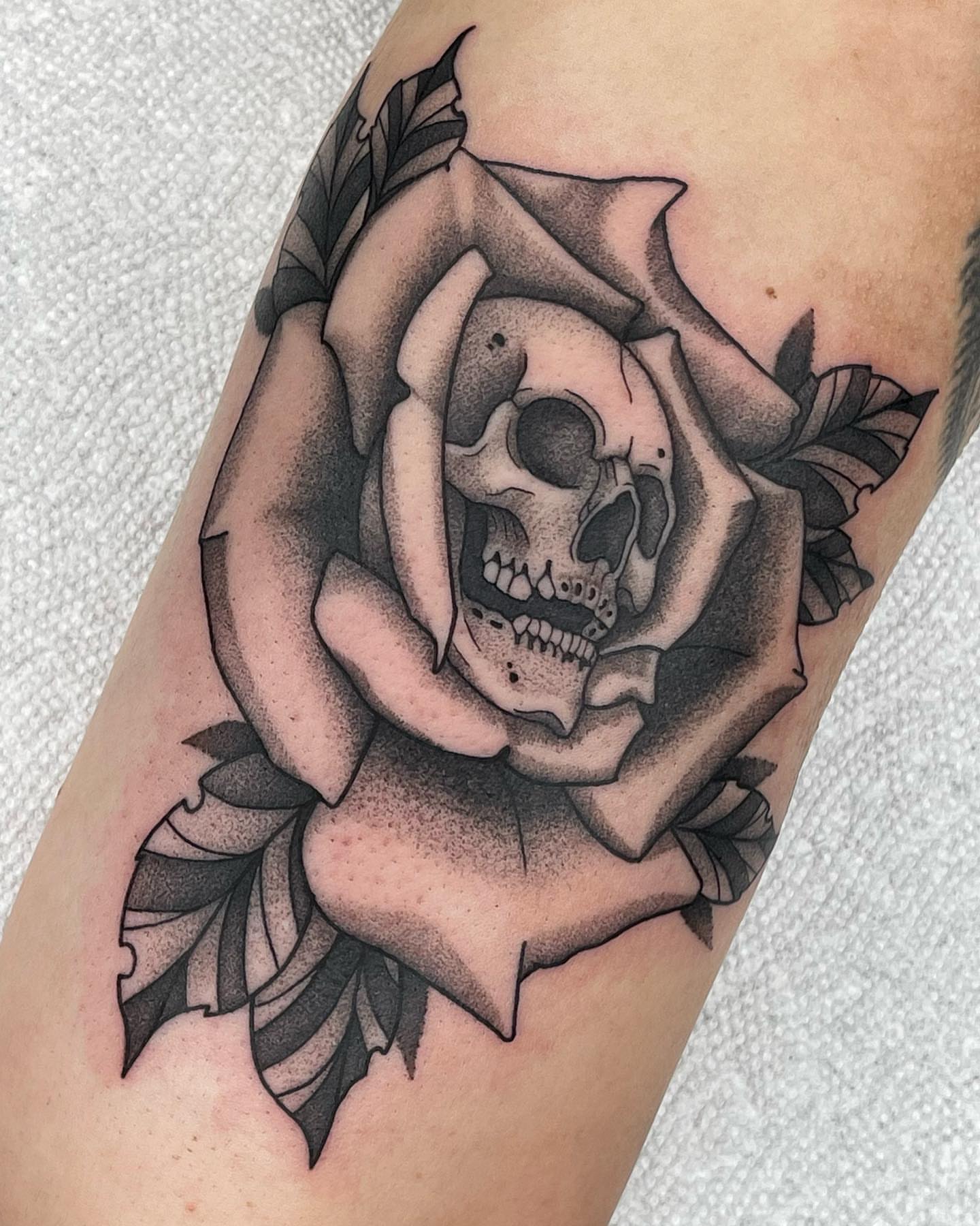 Rose with skull dotwork tattoo on the forearm by Anastasia Vives