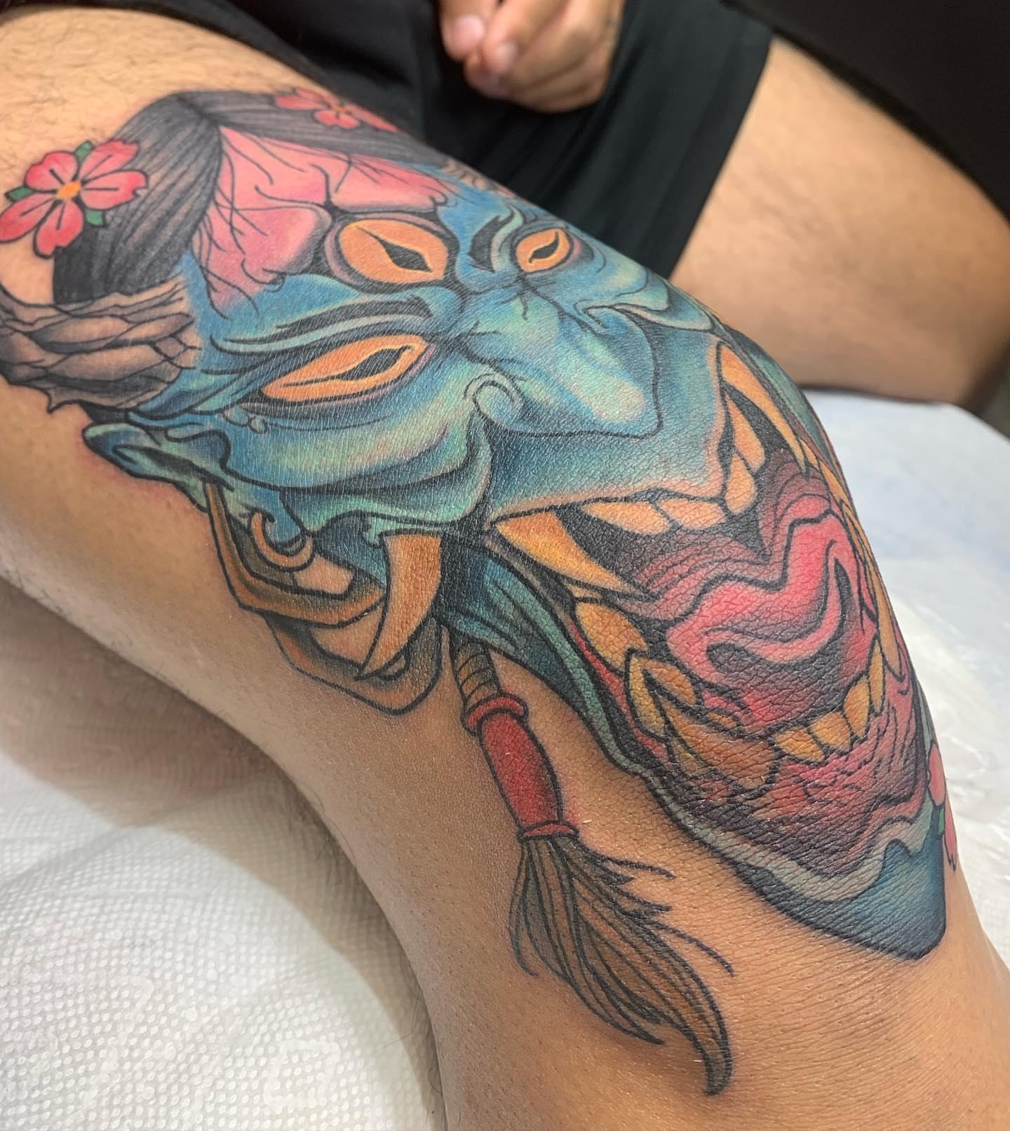 Mask japanese irezumi tattoo on the thigh by ATLANTA Queer Tattooer