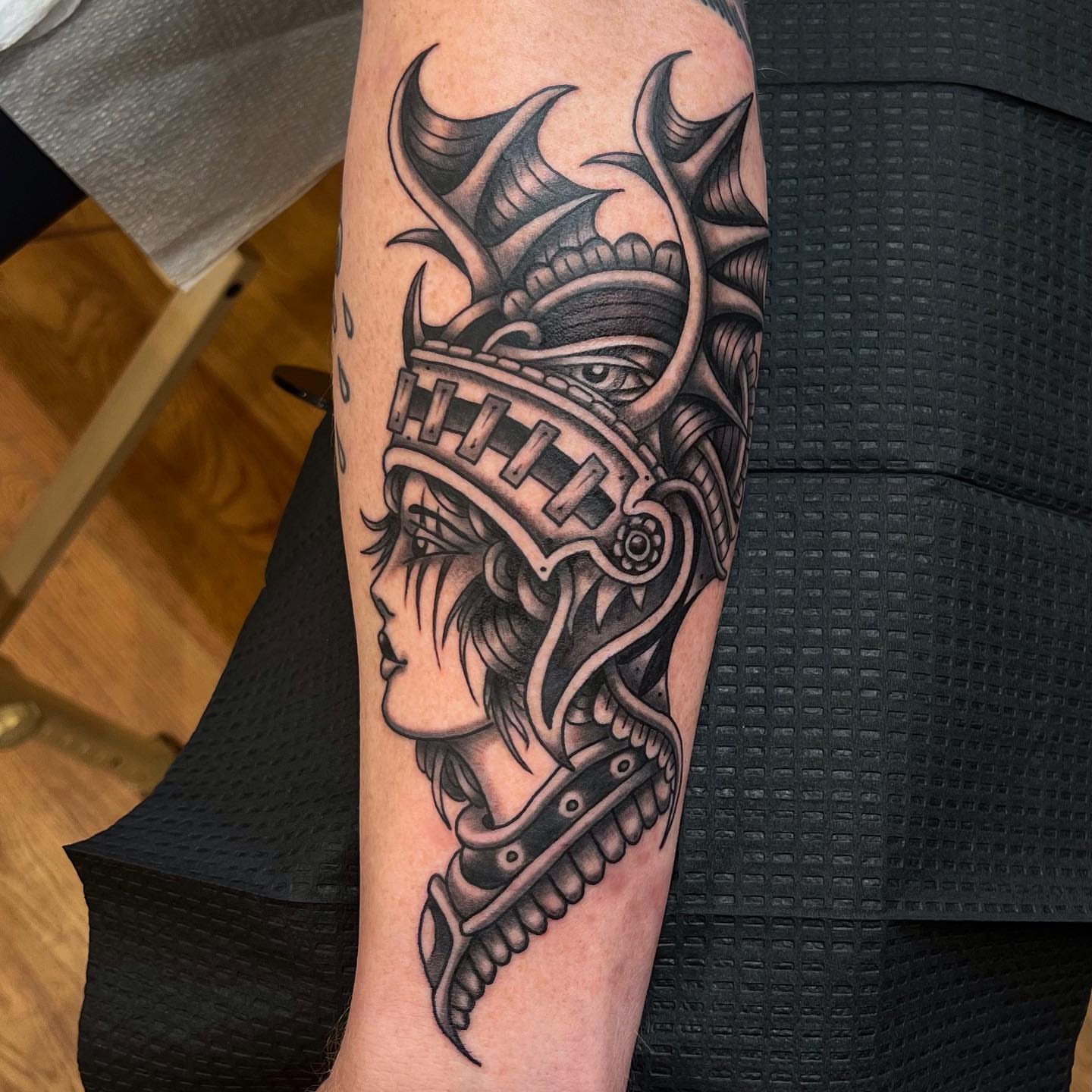 Woman warrior helmet realism tattoo on the forearm by David Mendieta
