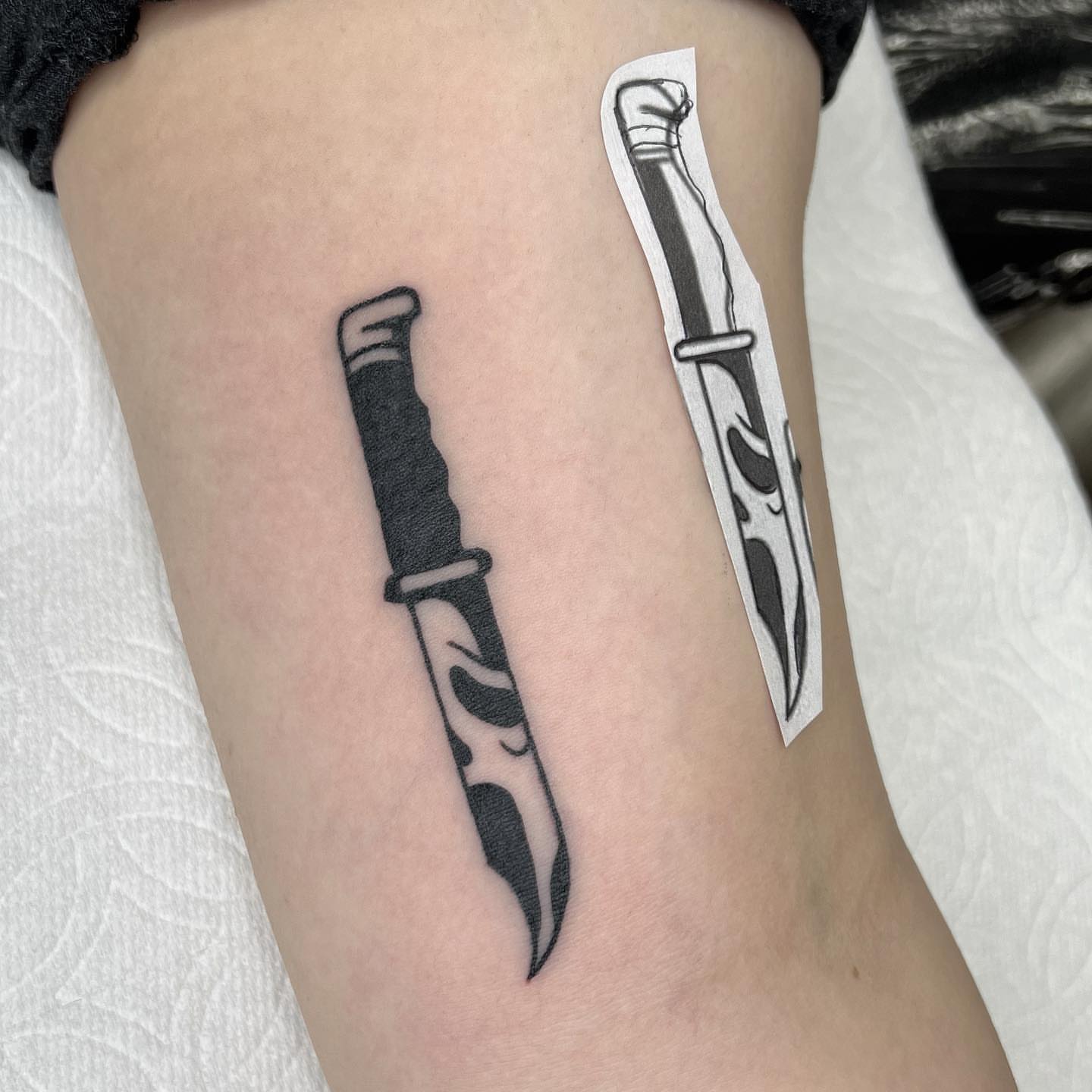 Knife black and grey tattoo on the forearm by Summer Rain