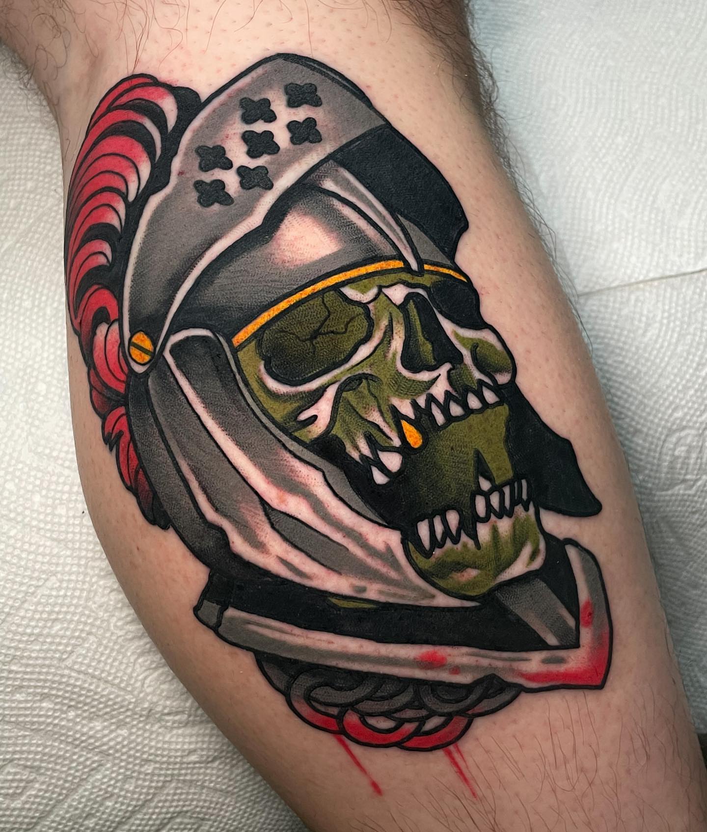 Skull knight helmet American traditional tattoo on the thigh by Cory Cartwright
