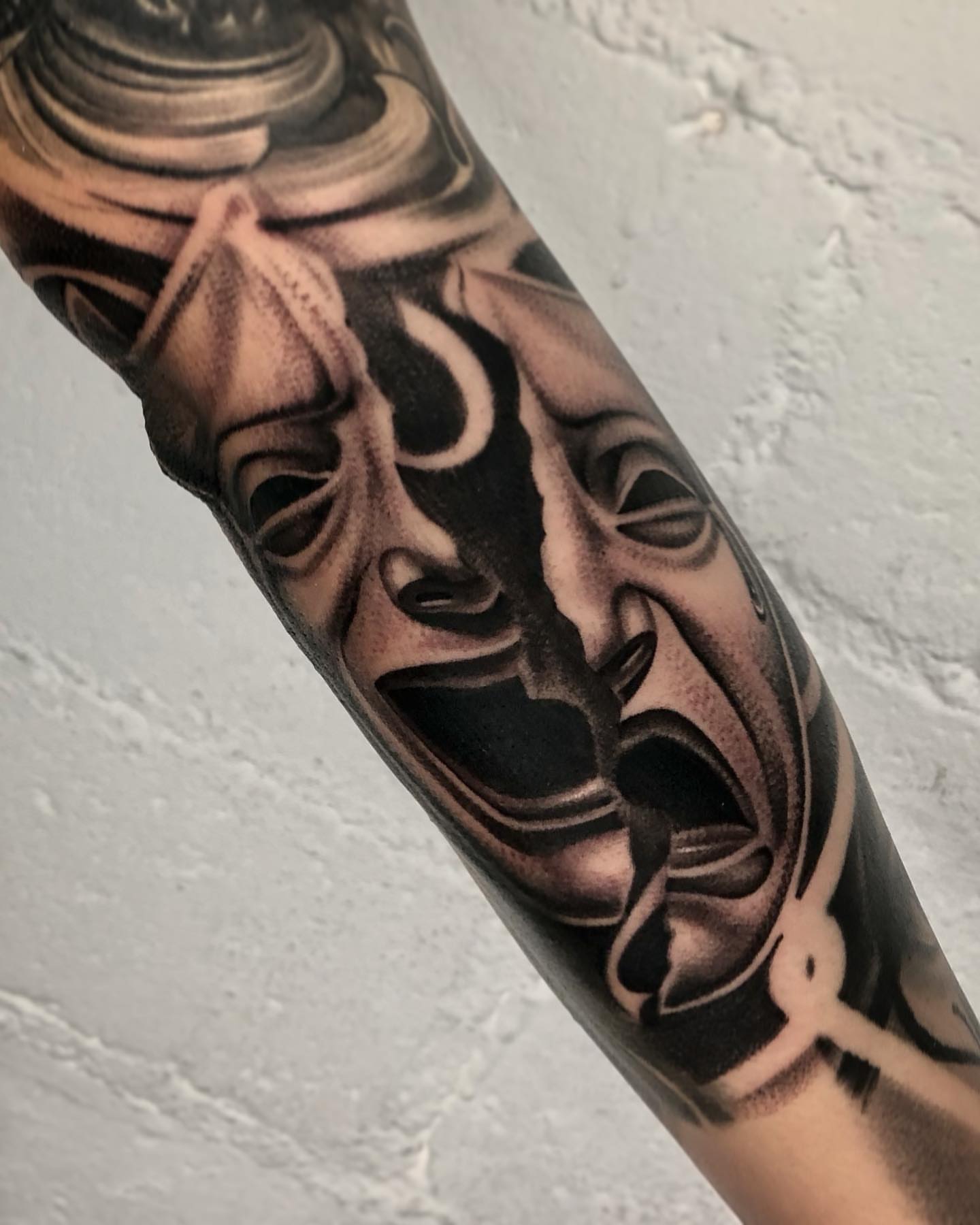 Mask realism tattoo on the forearm by David Torres