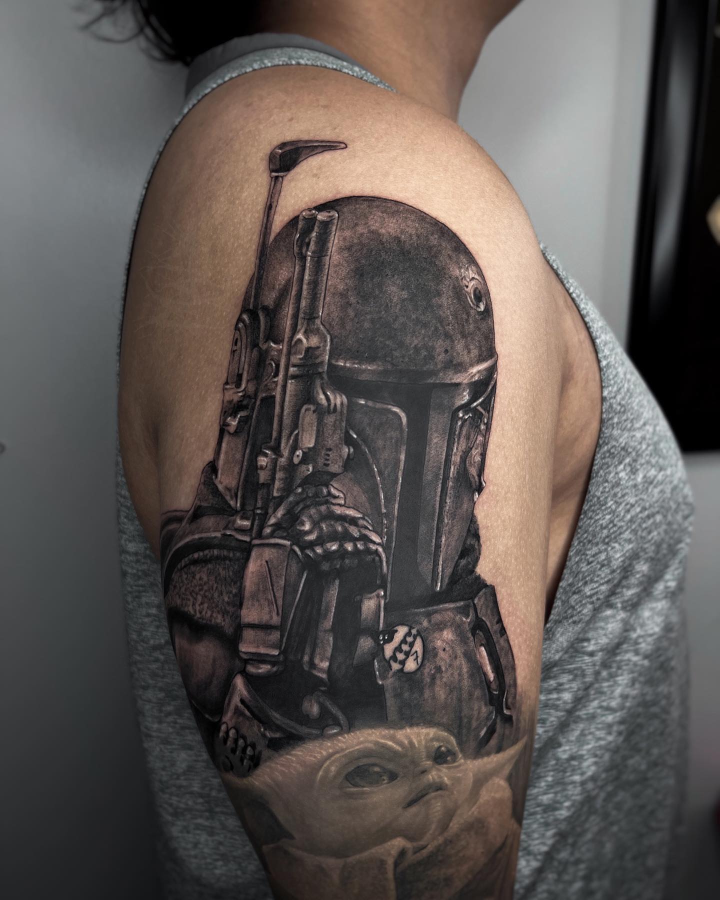 Boba Fett and Baby Yoda realism tattoo on the shoulder by Matthew Diaz