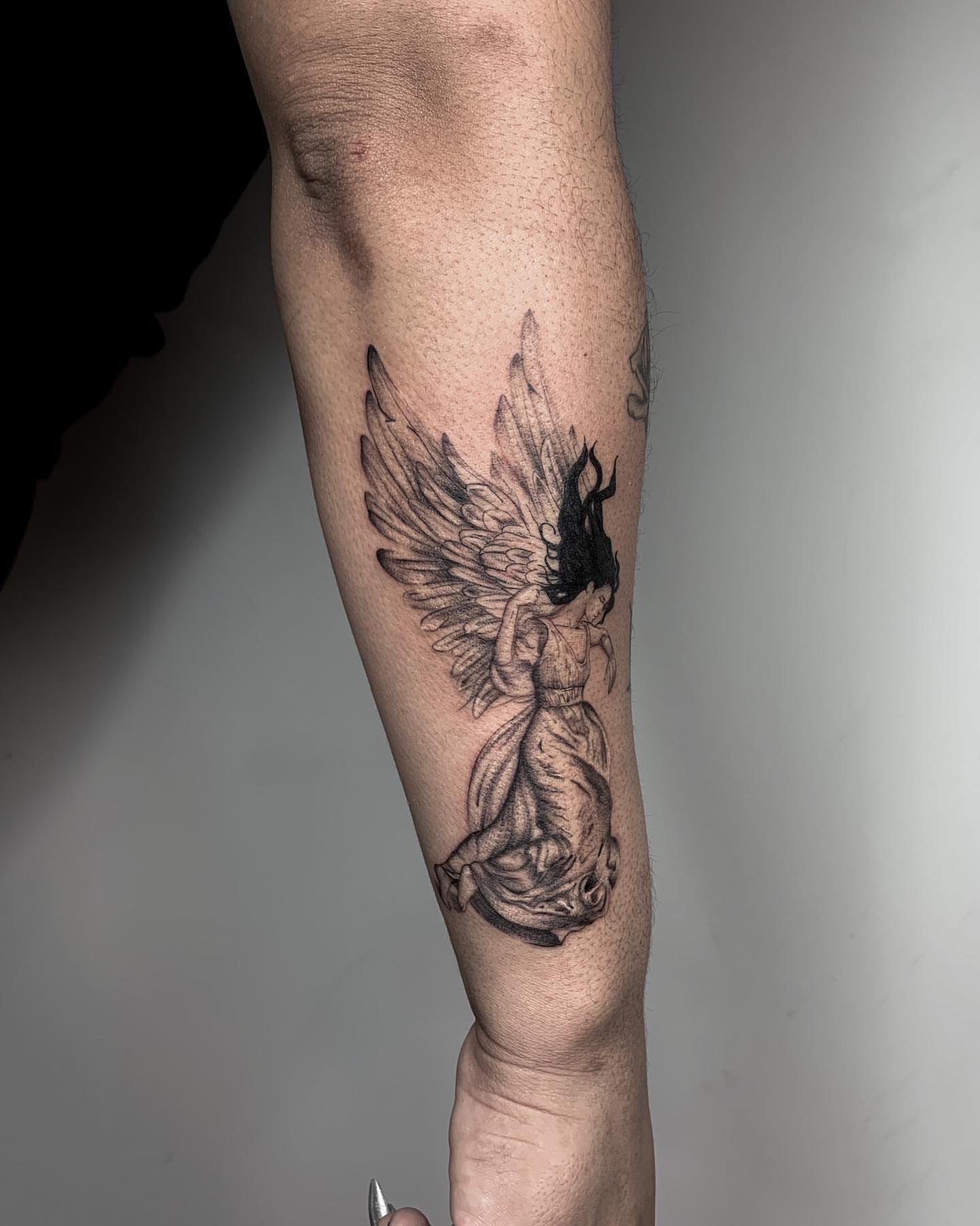 Angel with wings realism tattoo on the forearm by Priscila, Los Angeles, California