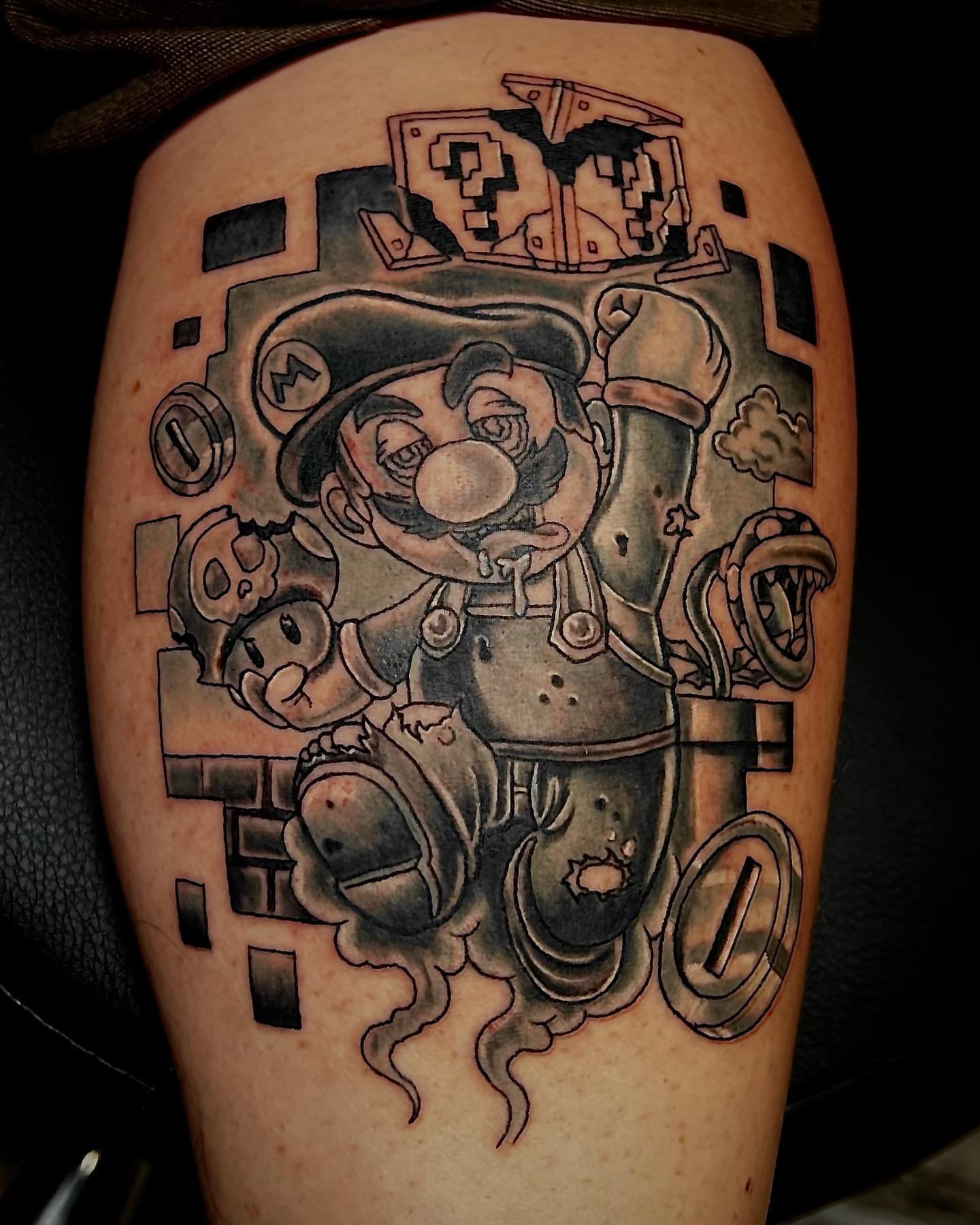Mario black and grey tattoo on the thigh by Luis Cabrera, Cleveland, Ohio
