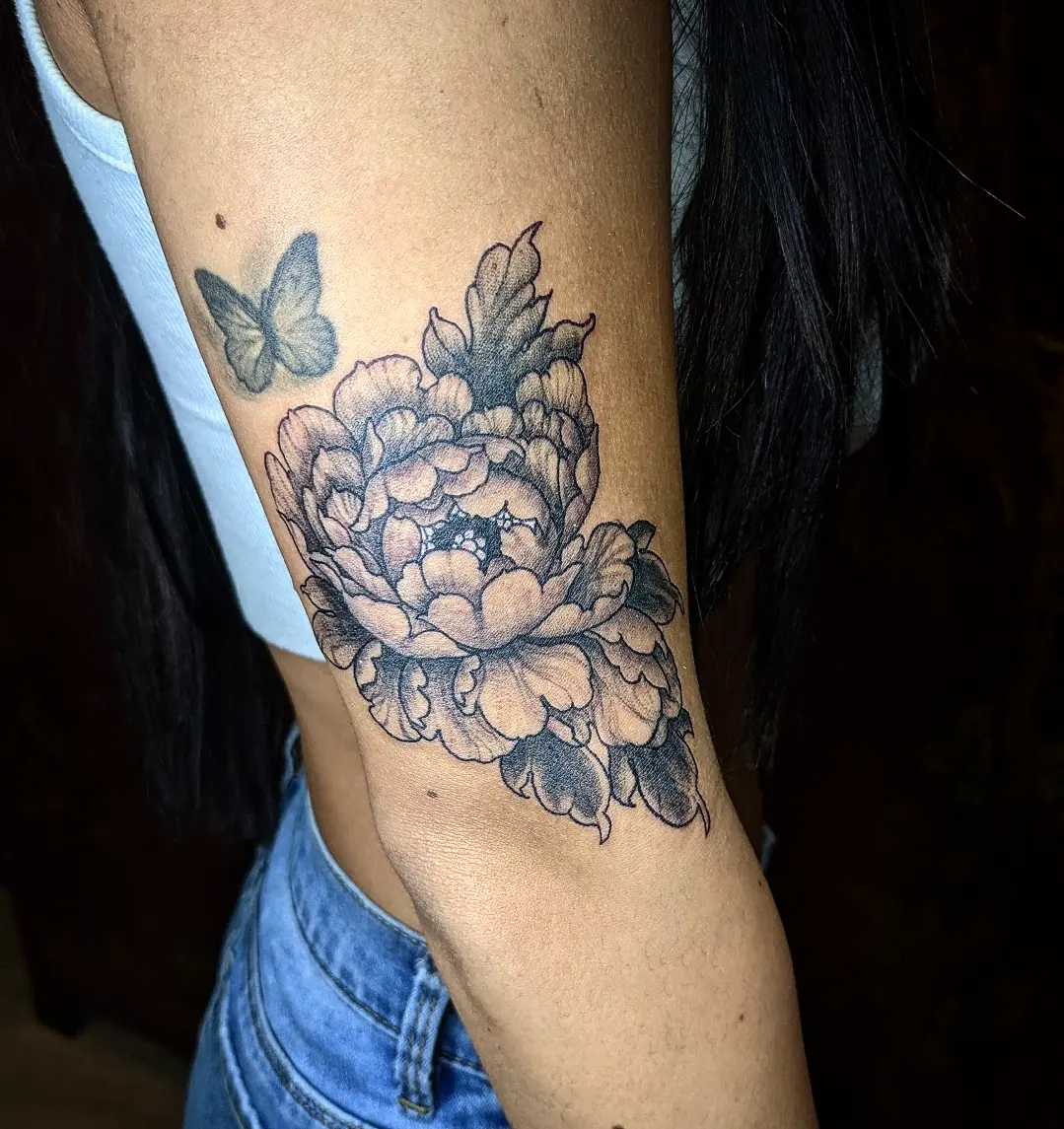 Peony flower black and grey tattoo on the forearm by Aim 🤍