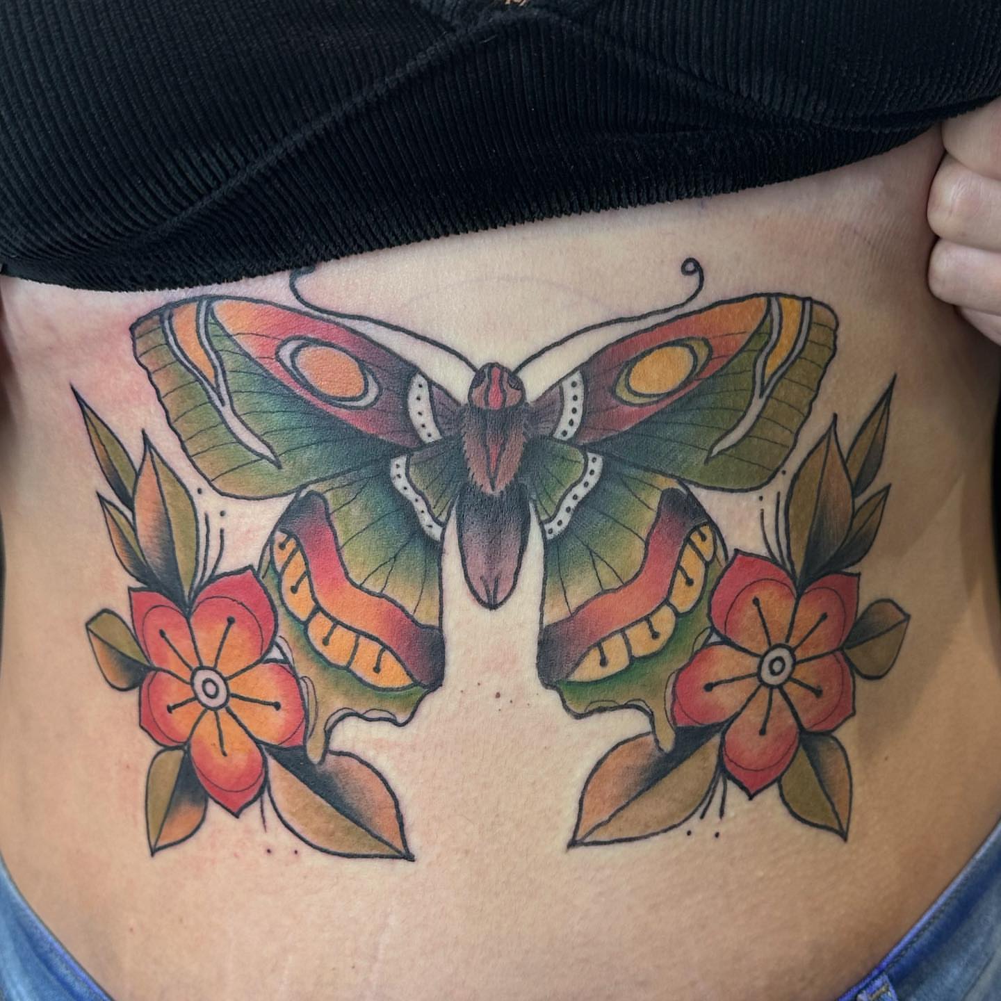 Butterfly and flowers American traditional tattoo on the ribs by ๐๐ฌ๐ฐ๐ฅ ๐๐ฌ๐ฌ๐ซ