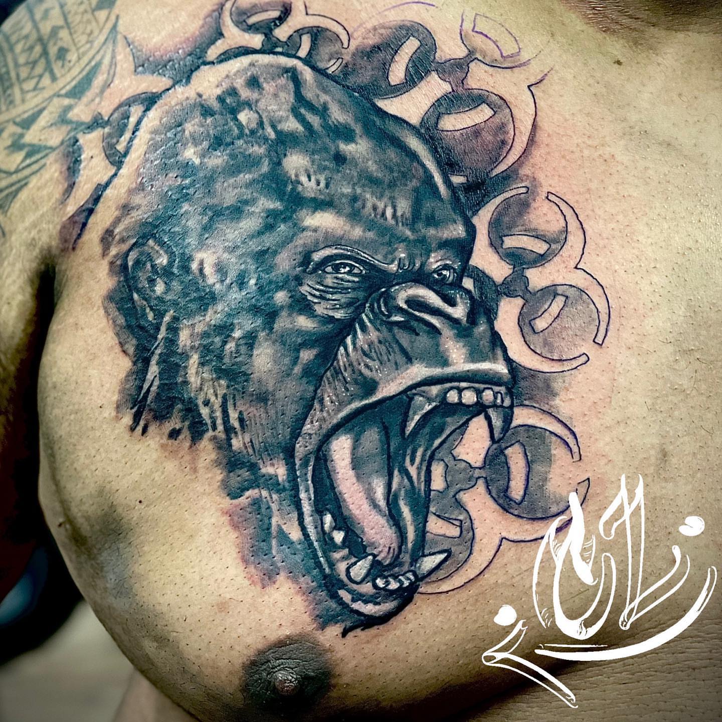 Gorilla realism tattoo on the chest by Labbé