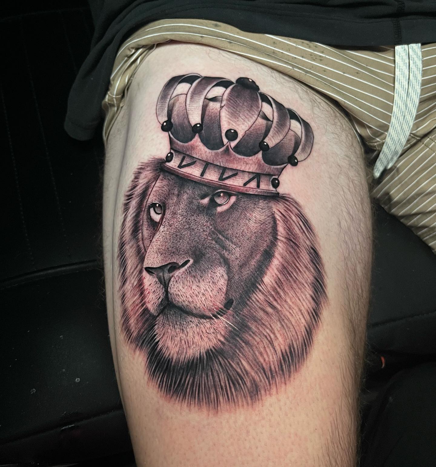 Lion with crown realism tattoo on the thigh by George Maldonado Austin, Austin, Texas