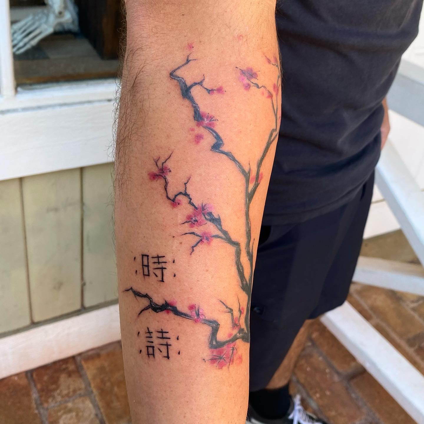 Cherry blossoms and kanji dotwork tattoo on the forearm by Sela ✨Las Vegas Tattoo Artist