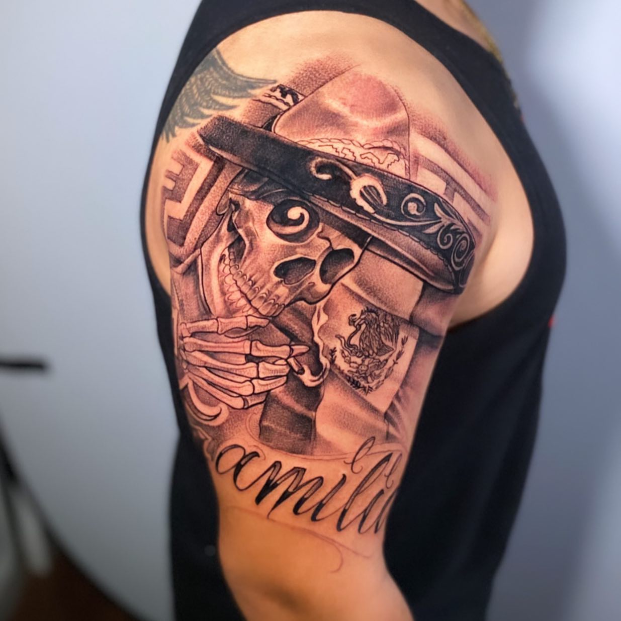 Skeleton wearing sombrero realism tattoo on the shoulder by Jared Soto