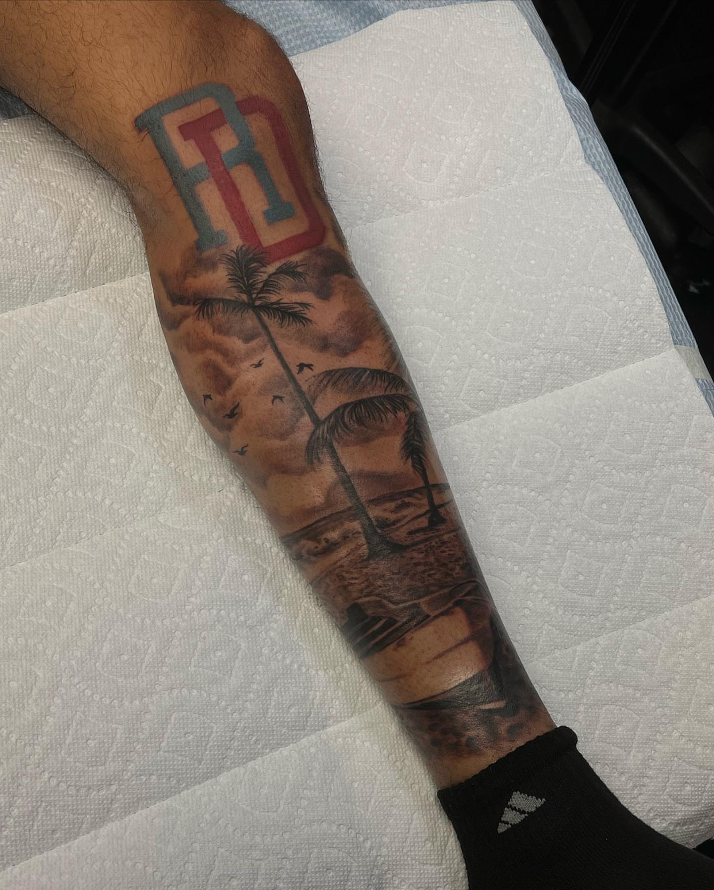 Beach sunset realism tattoo on the forearm by Lex⛓️